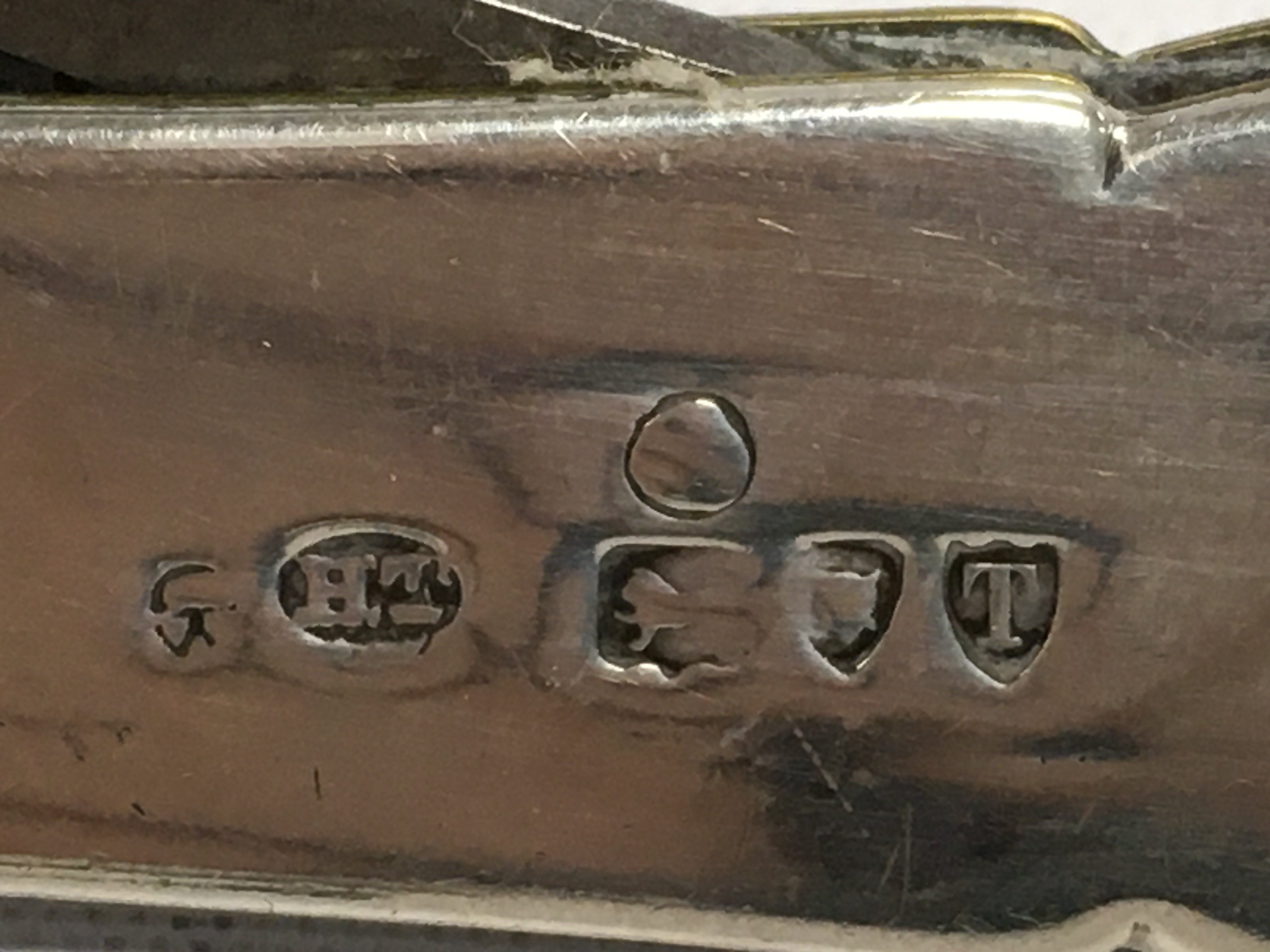 A 1894 silver double cigar cutter. Postage category A