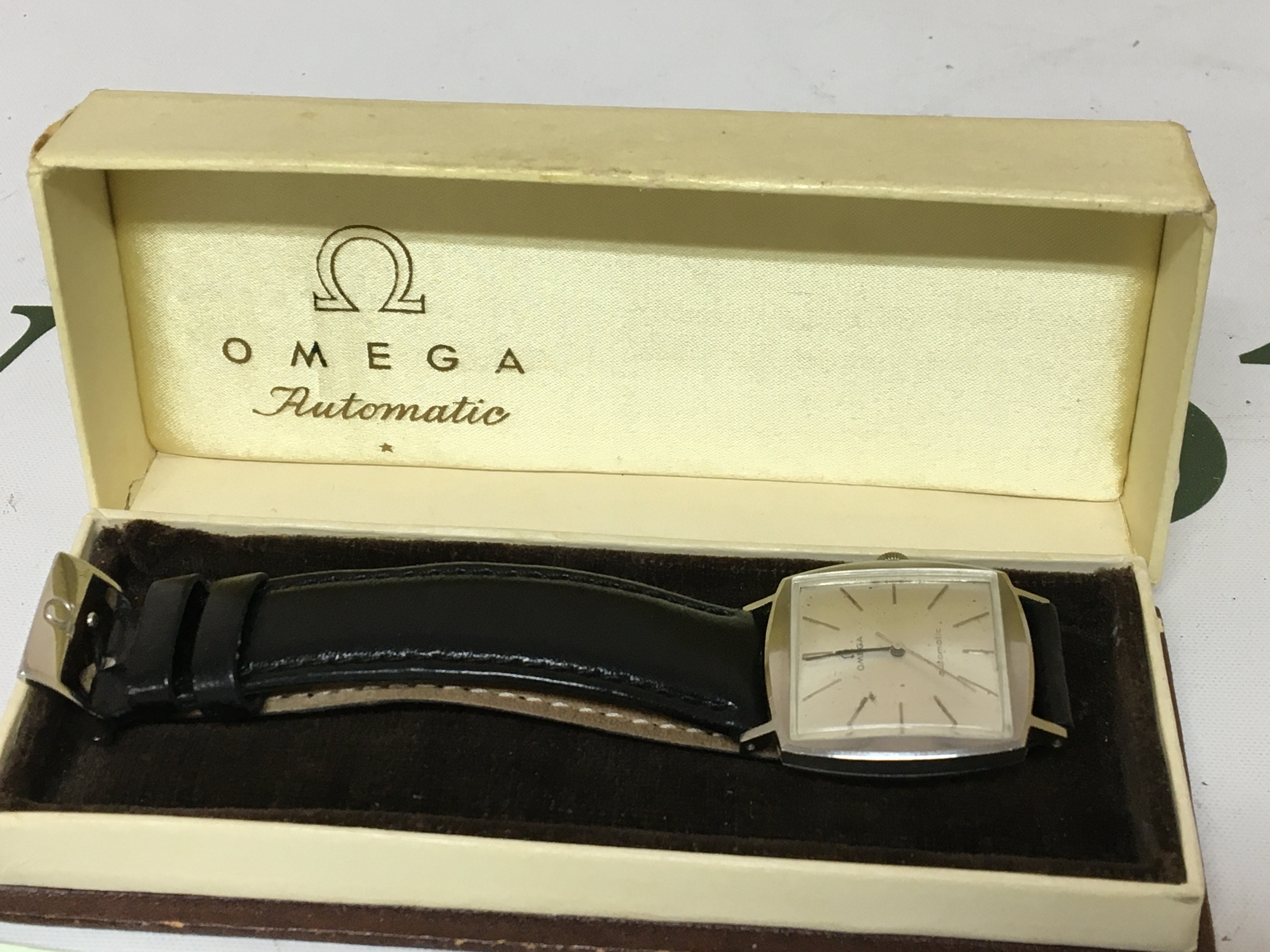 A Vintage Gents Omega Automatic wrist watch with a stainless steel cushion case watch seen working and with original box.