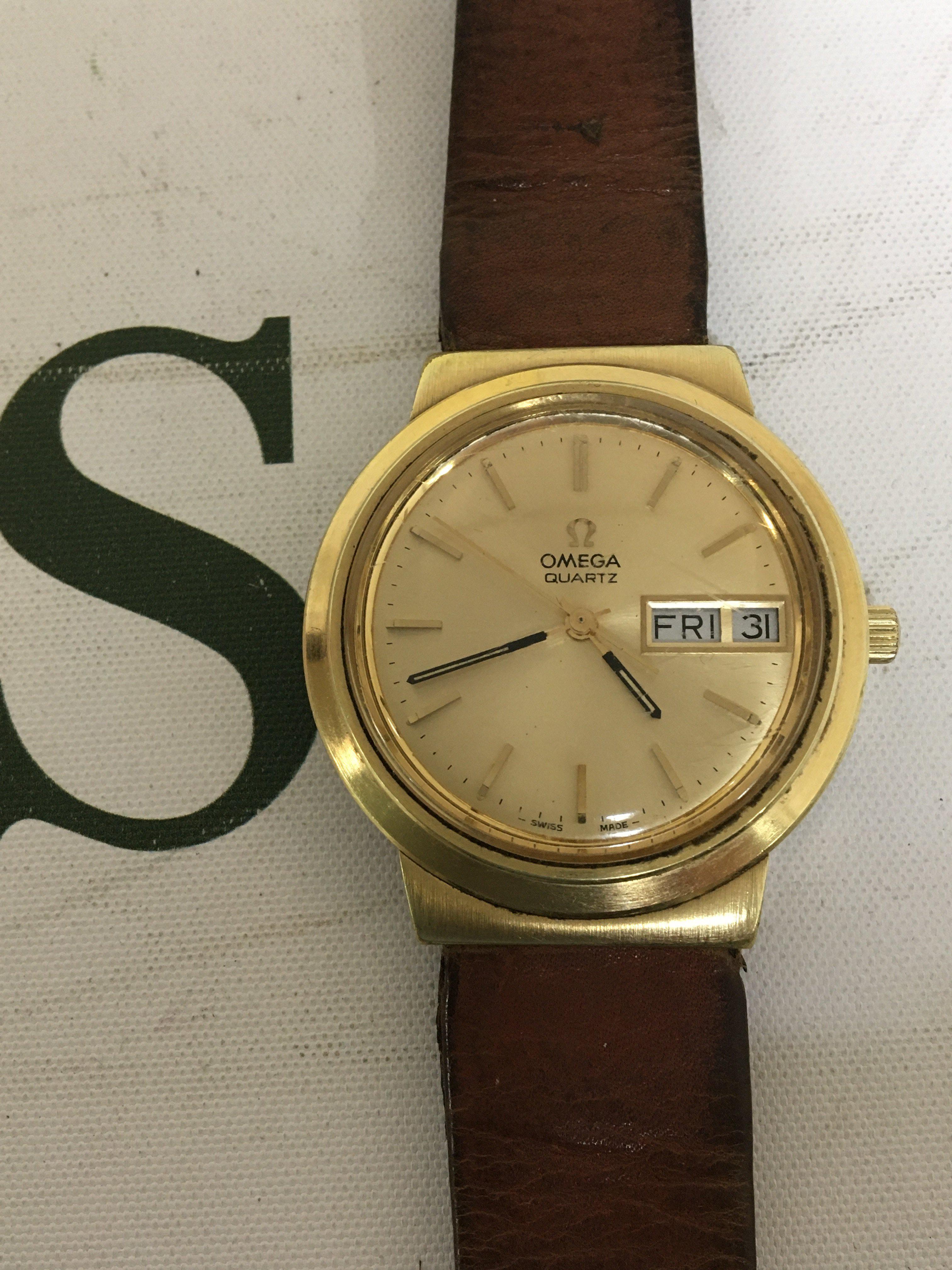 A Gents Omega mid 1970s watch gold plated case gold colour dial with day date aperture the reverse with personal inscription and date 1978. Not seen working all dial adjustments hands day date working.