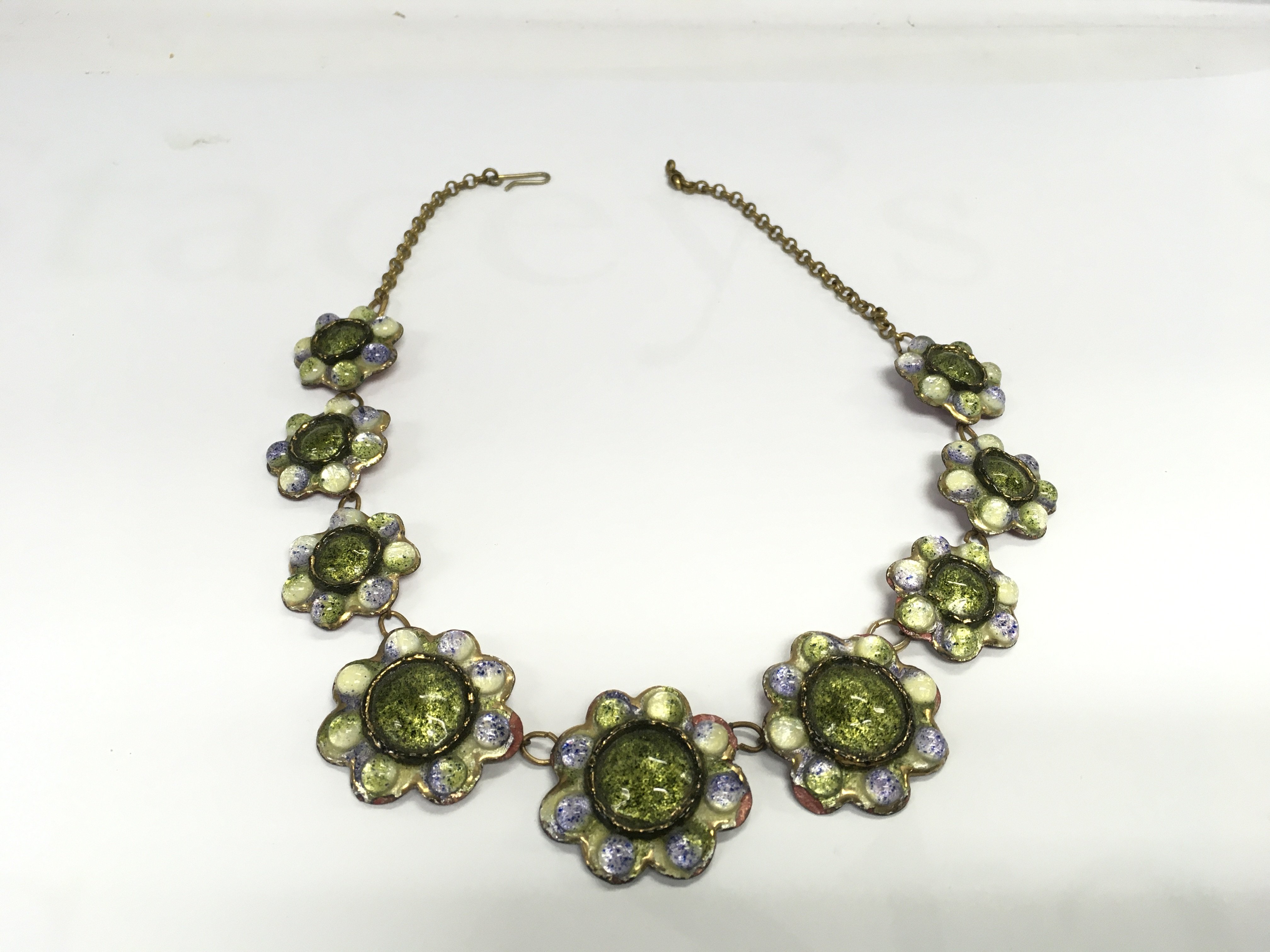 A vintage enamel floral necklace. Postage B