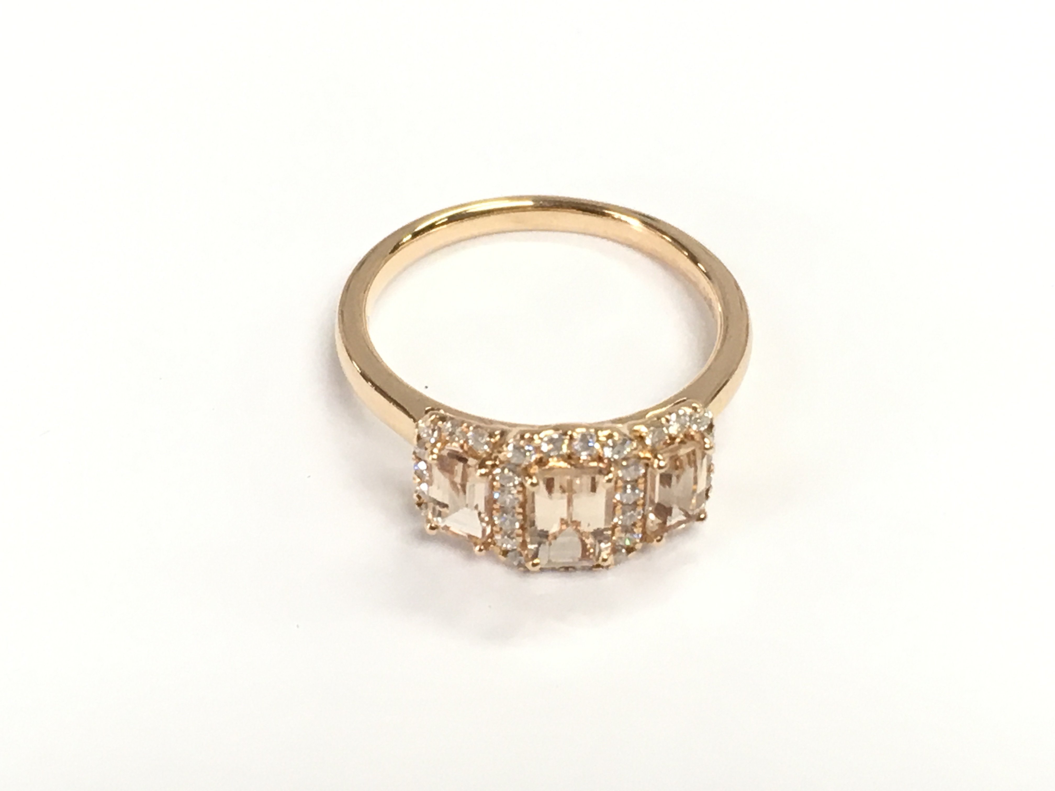 18ct rose gold ring set with three morganites each surrounded by diamonds. Morganites 1.17ct diamonds 0.32ct. Size O 1/2 approximately.