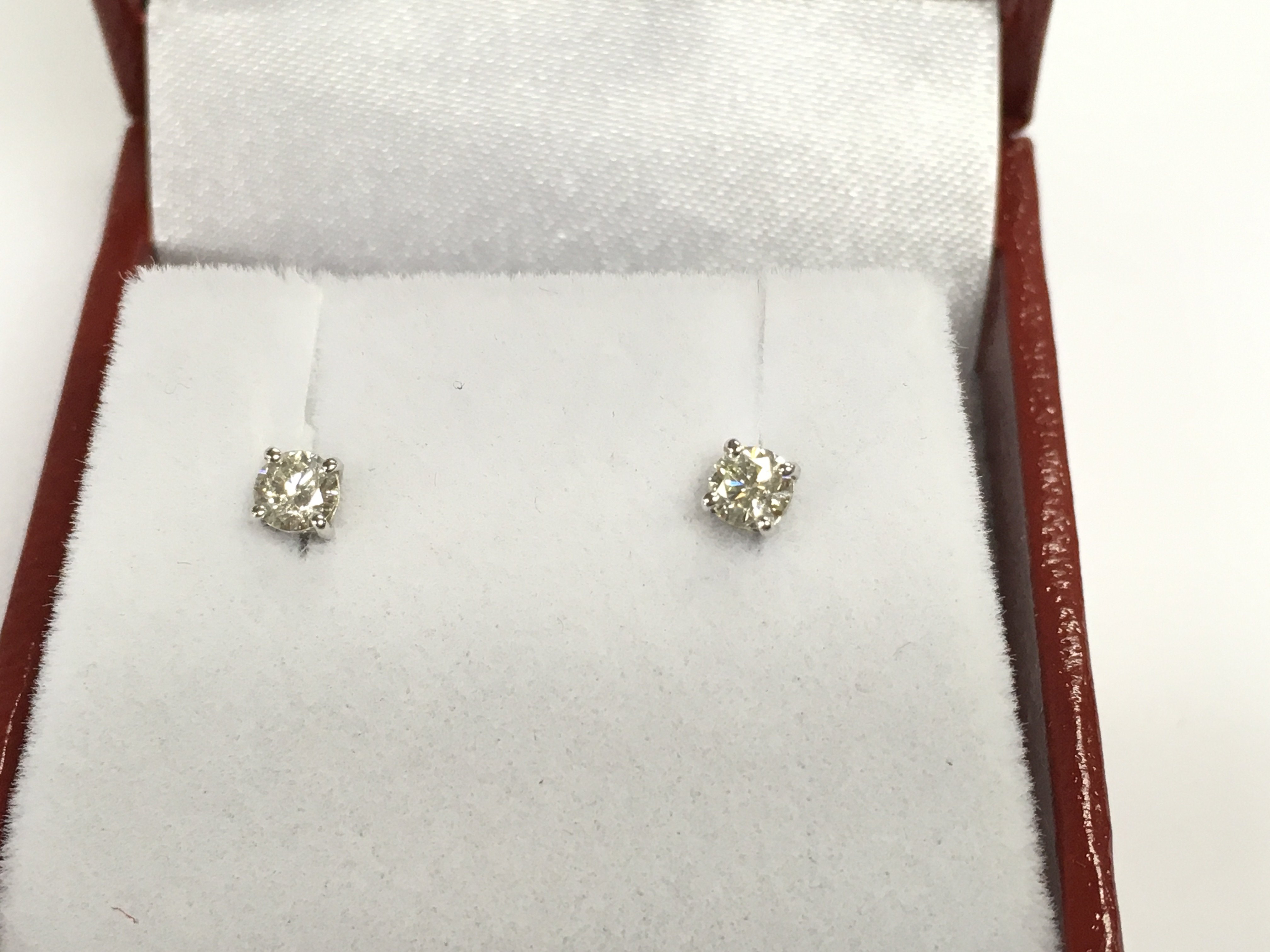 Pair of 18ct white gold diamond solitaire studs. Diamond 0.30ct total,