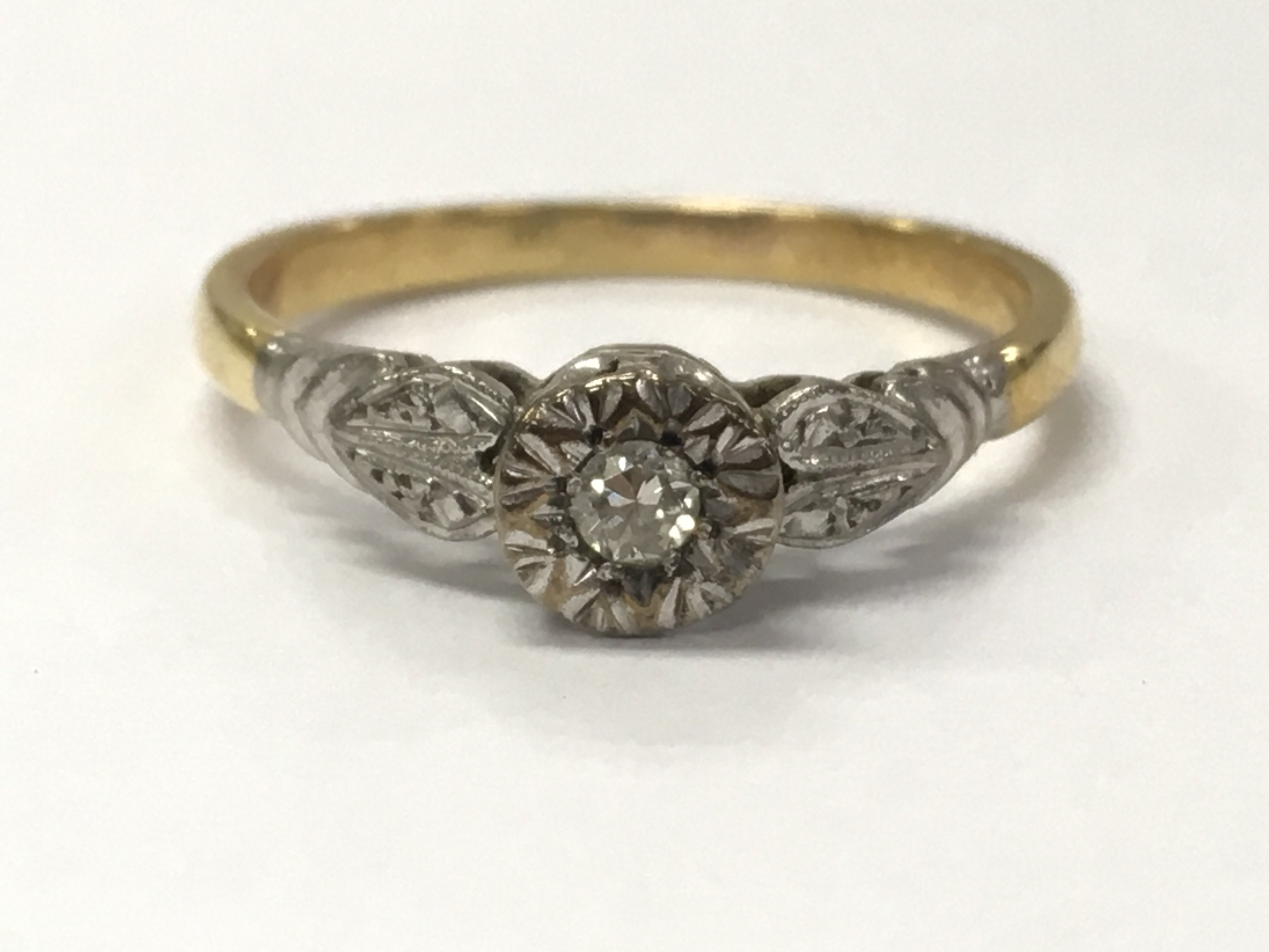 An 18ct and platinum diamond ring , 2.6g total weight. postage category A