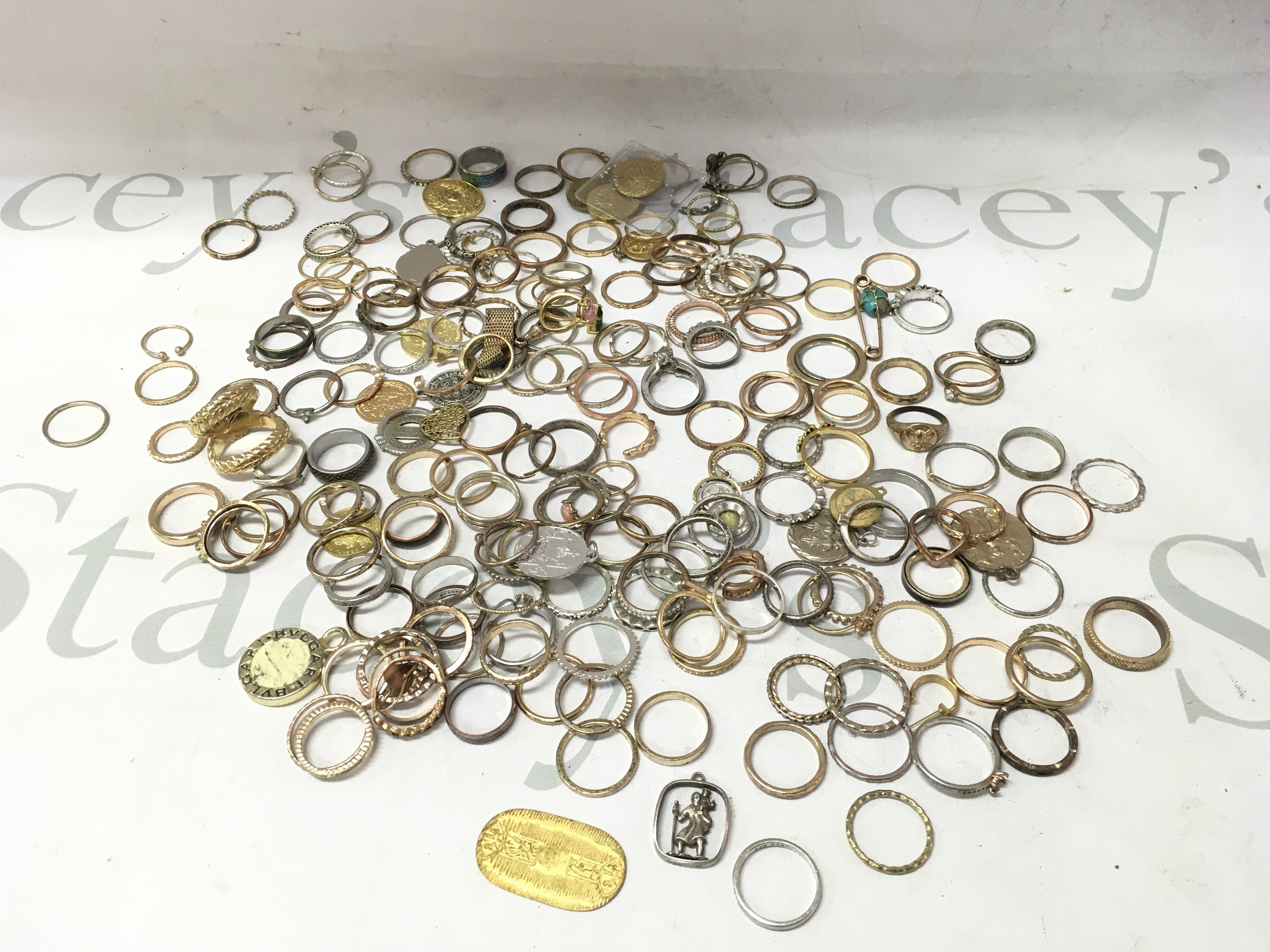 A collection of assorted costumes jewellery including rings earrings pendants etc including some silver examples.