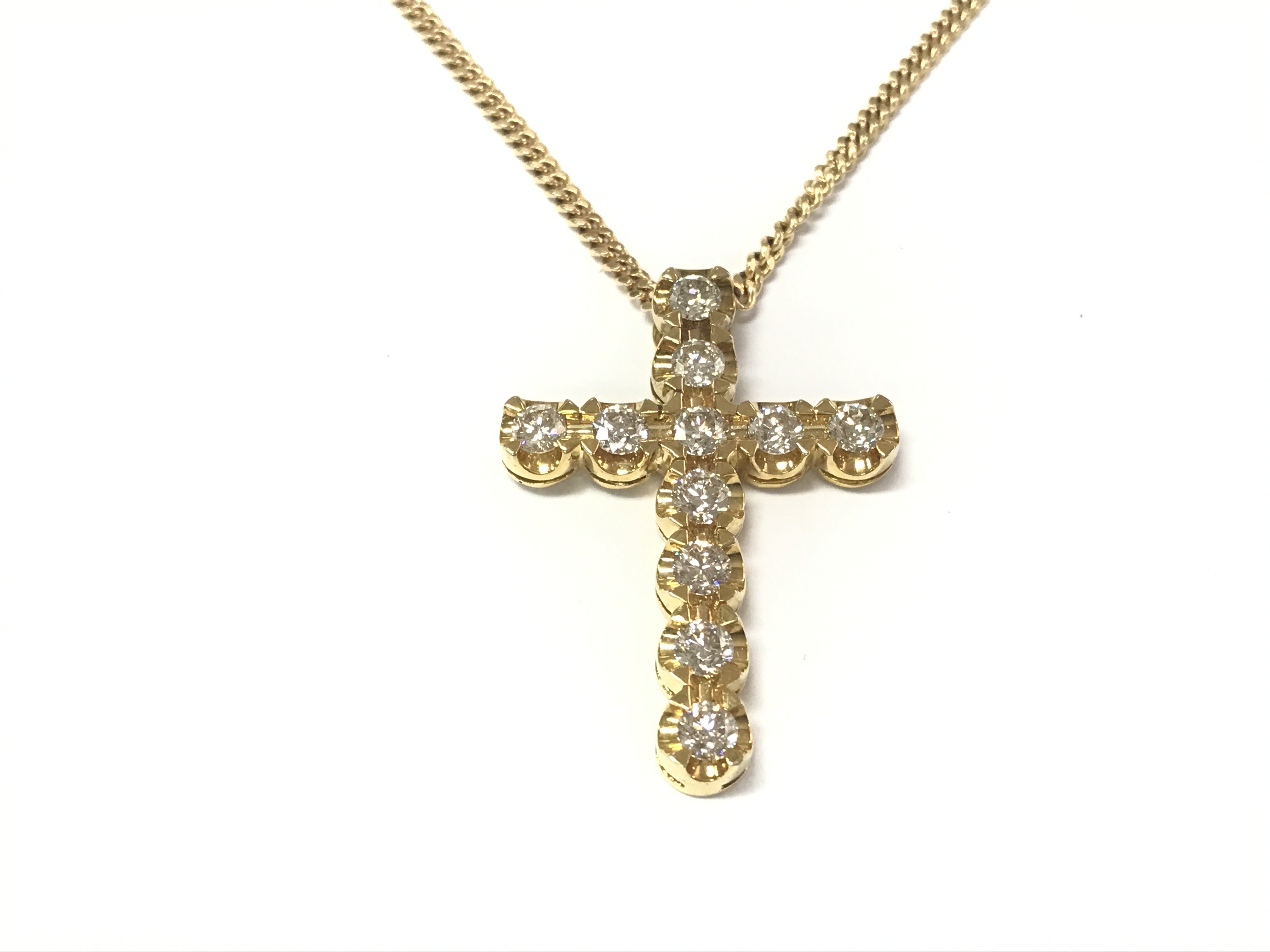 A 9ct gold cross set with diamonds on a 9ct gold chain. Diamonds 2.70ct Comes with gemological report.