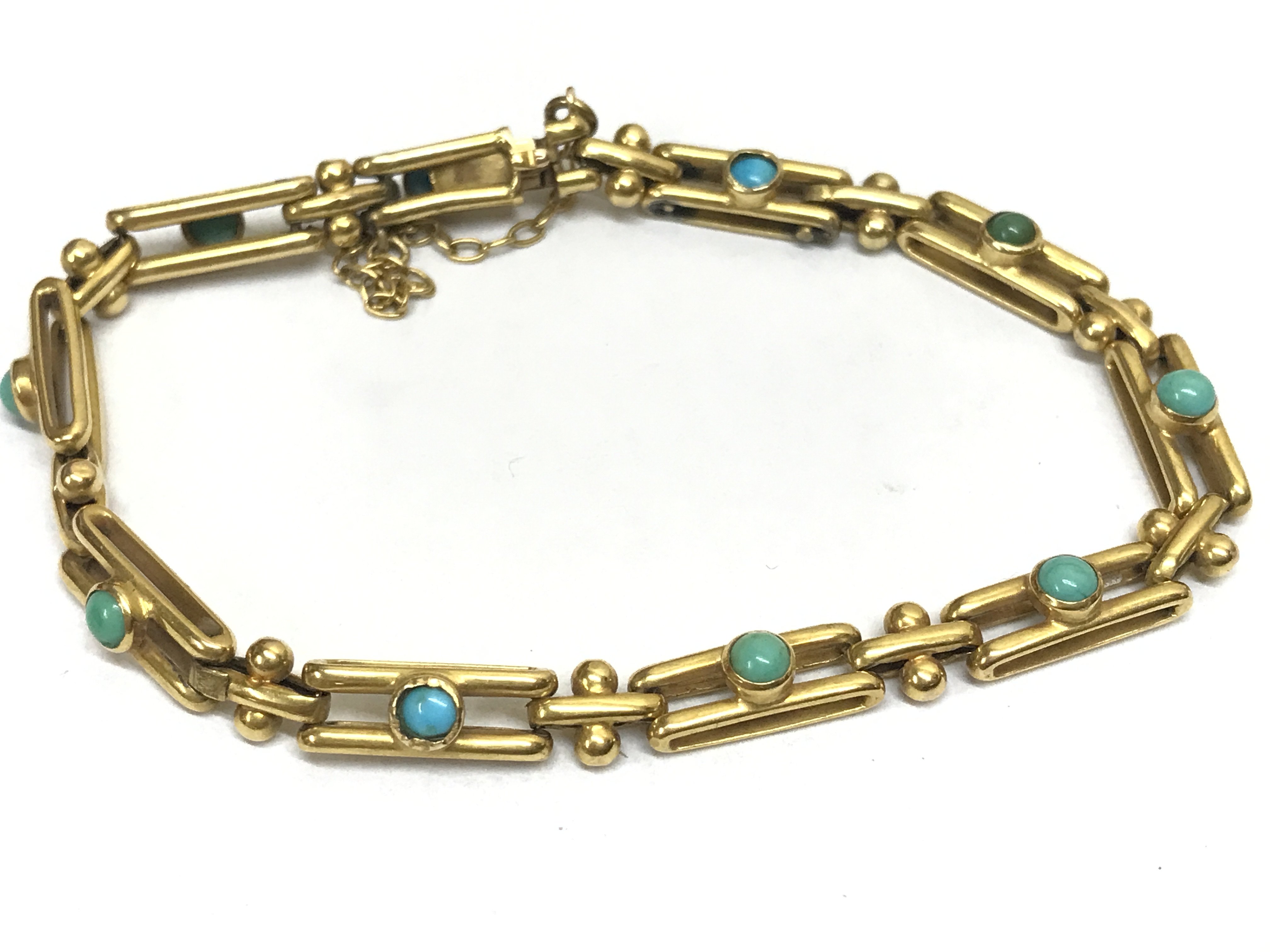 An Edwardian turquoise stone set bracelet . Postage category A