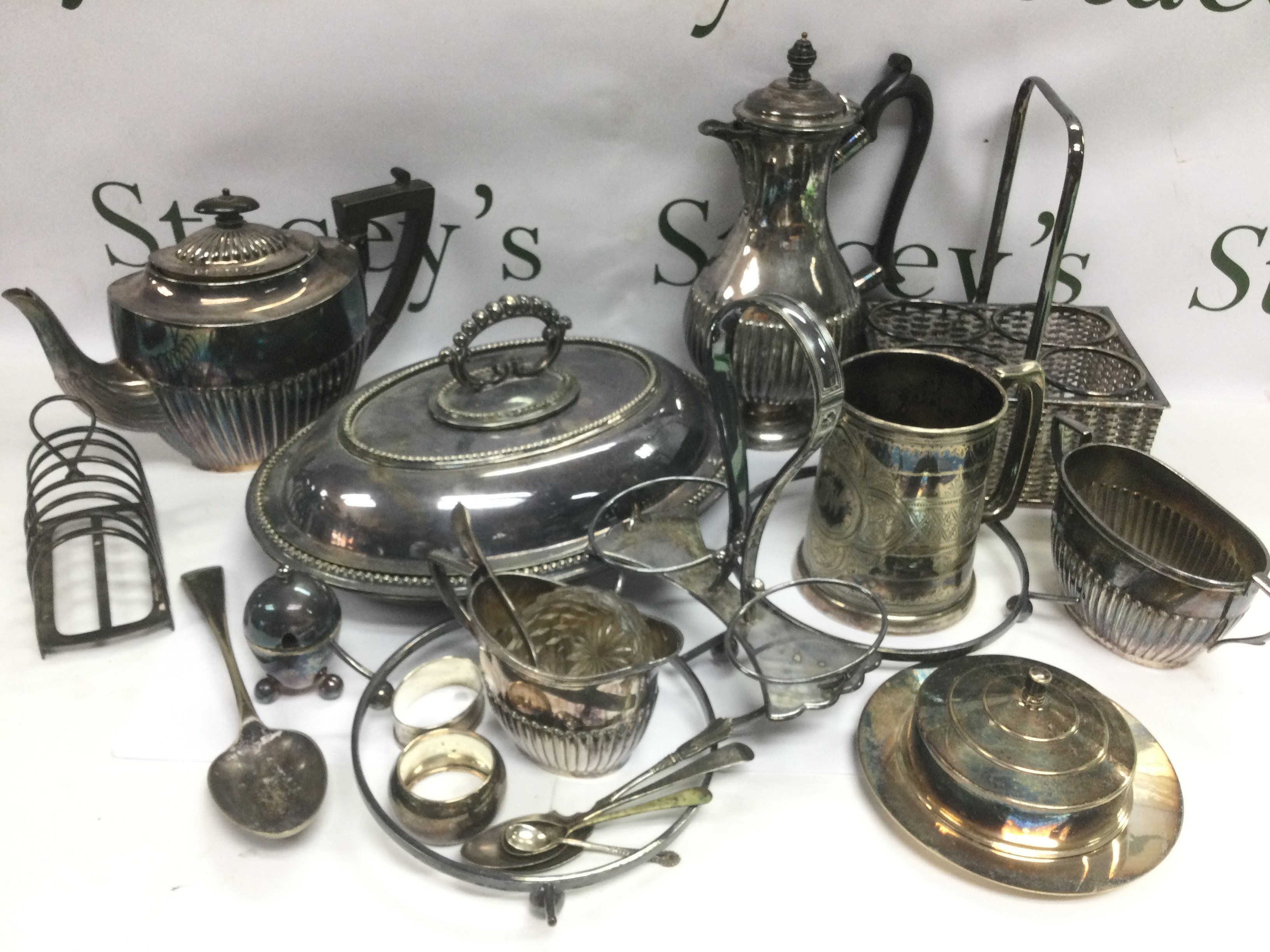 A collection of silver plated items including a coffee pot, tankard etc. Shipping category D.