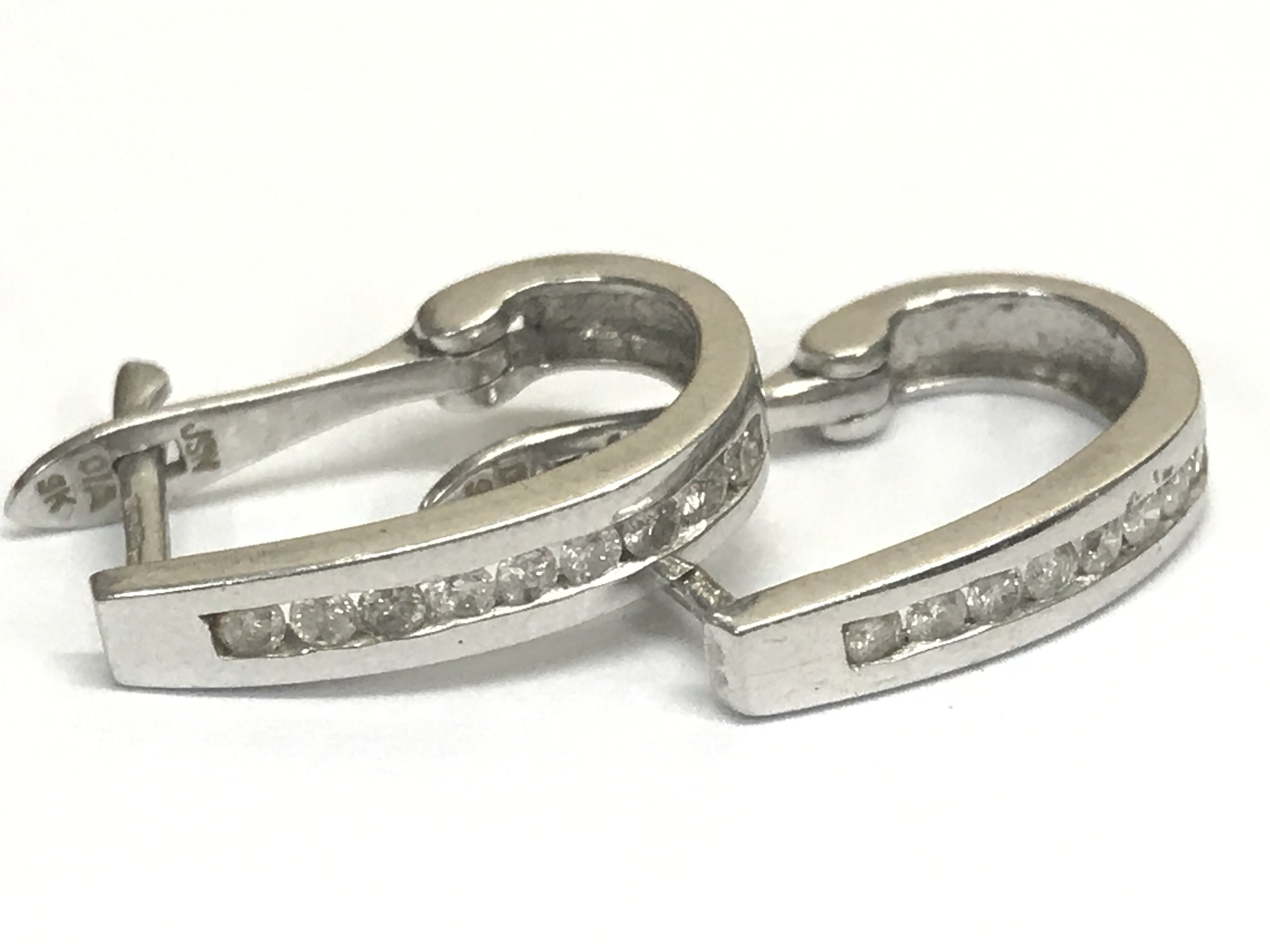 9ct white gold and diamond earrings , 1.9g total weight. Postage category A