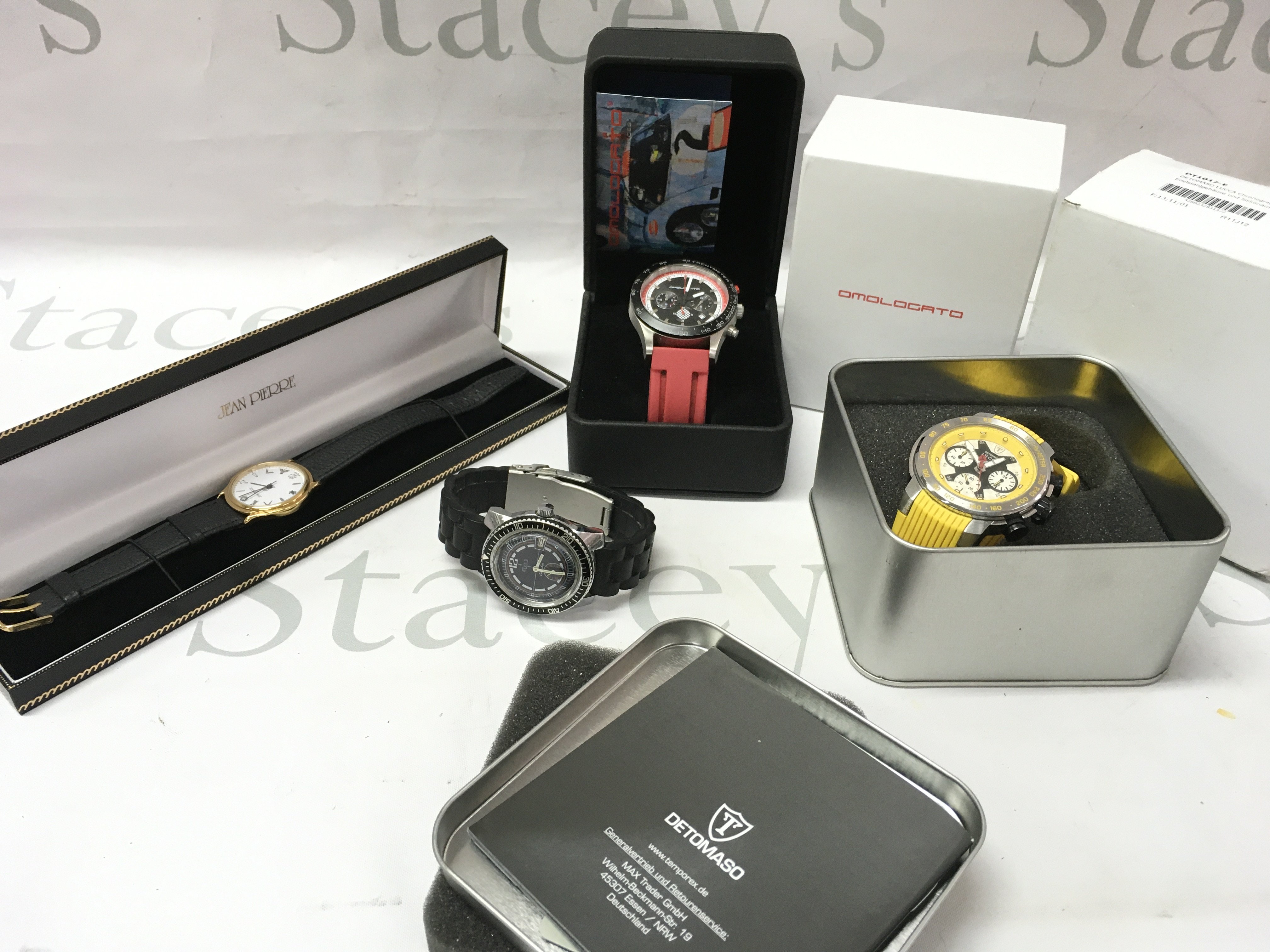 A collection of four fashion watches including Detomaso Lucca, Jean Pierre, Elves etc. postage category B