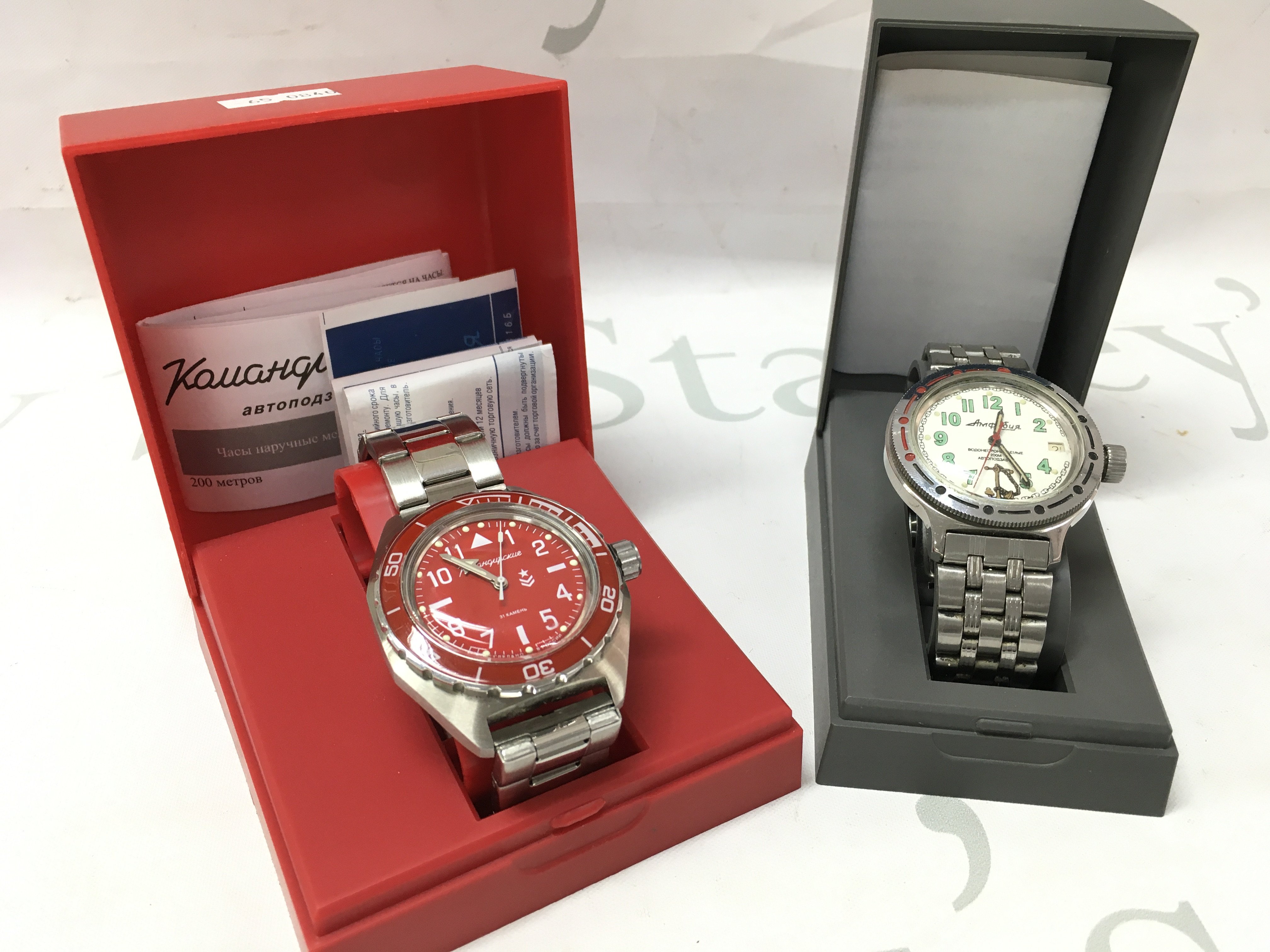 Boxed Vostok Sea Captain Amphibian Automatic Self-Winding Russian Diver Watch and a red Vostok Komandirskie Mechanical Automatic watch. Postage category B