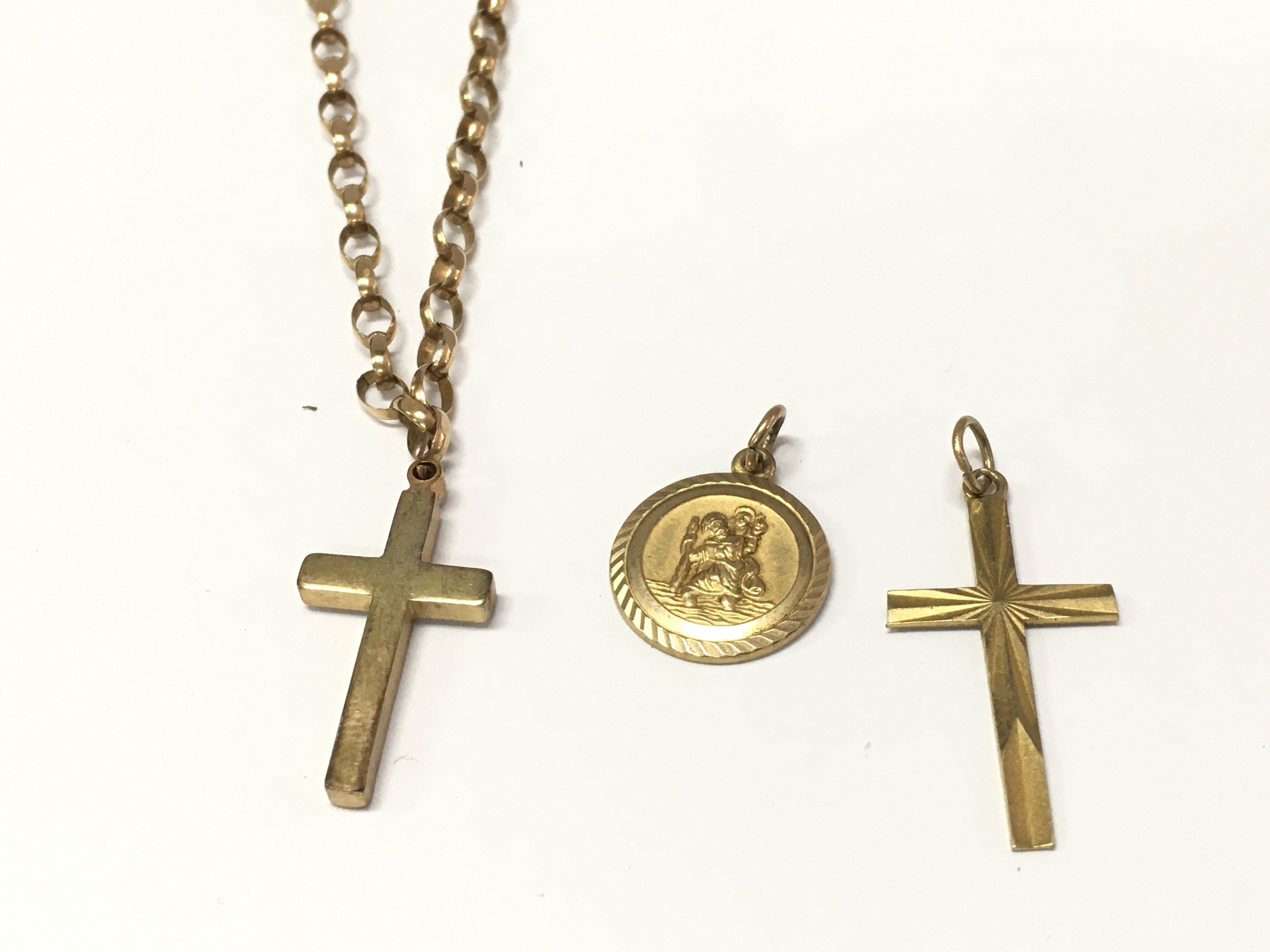 A 9ct gold belcher style chain with cross pendant and two other 9ct gold pendants. 9.64g