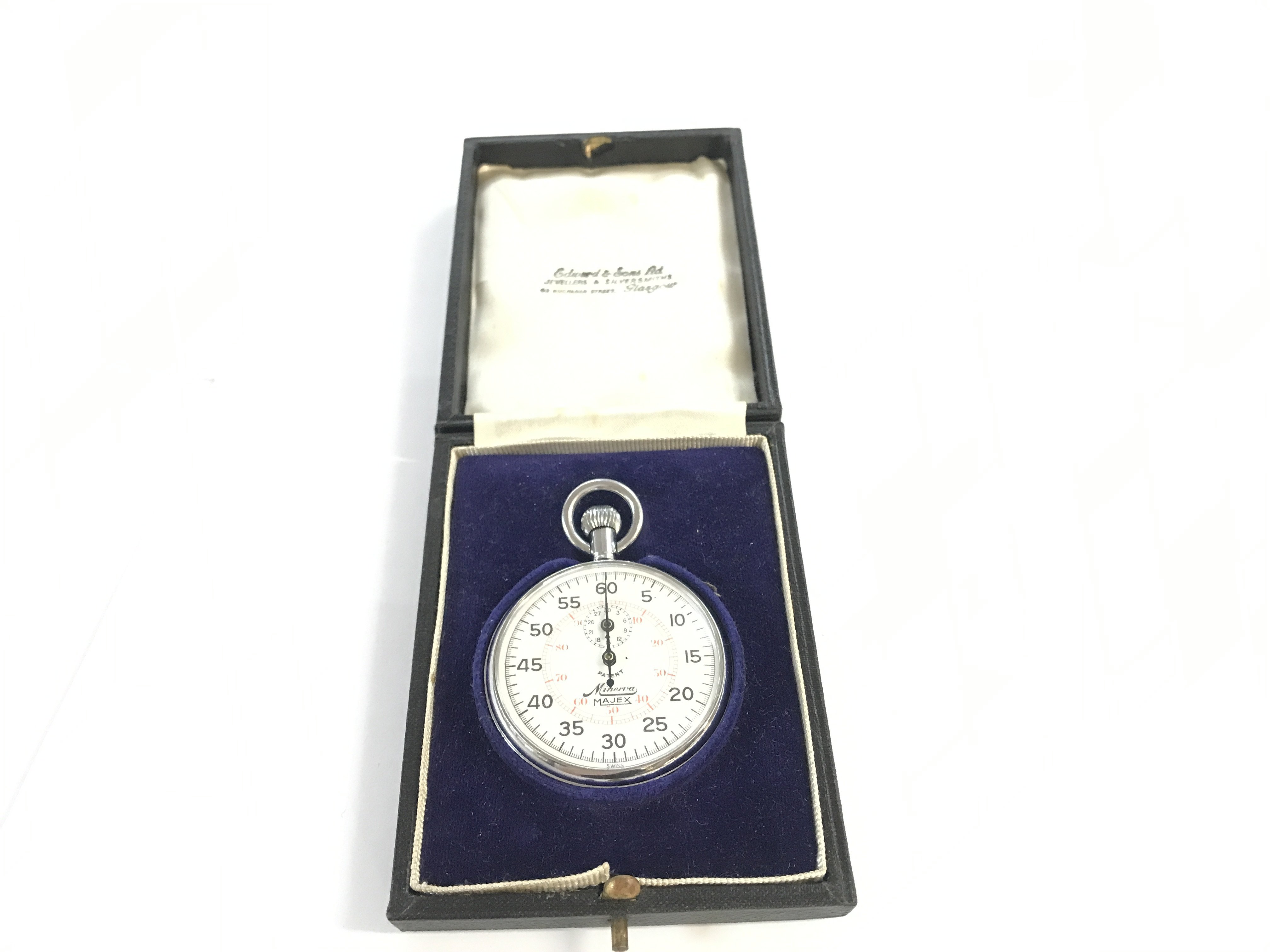 A boxed Minerva Majex silver stopwatch.