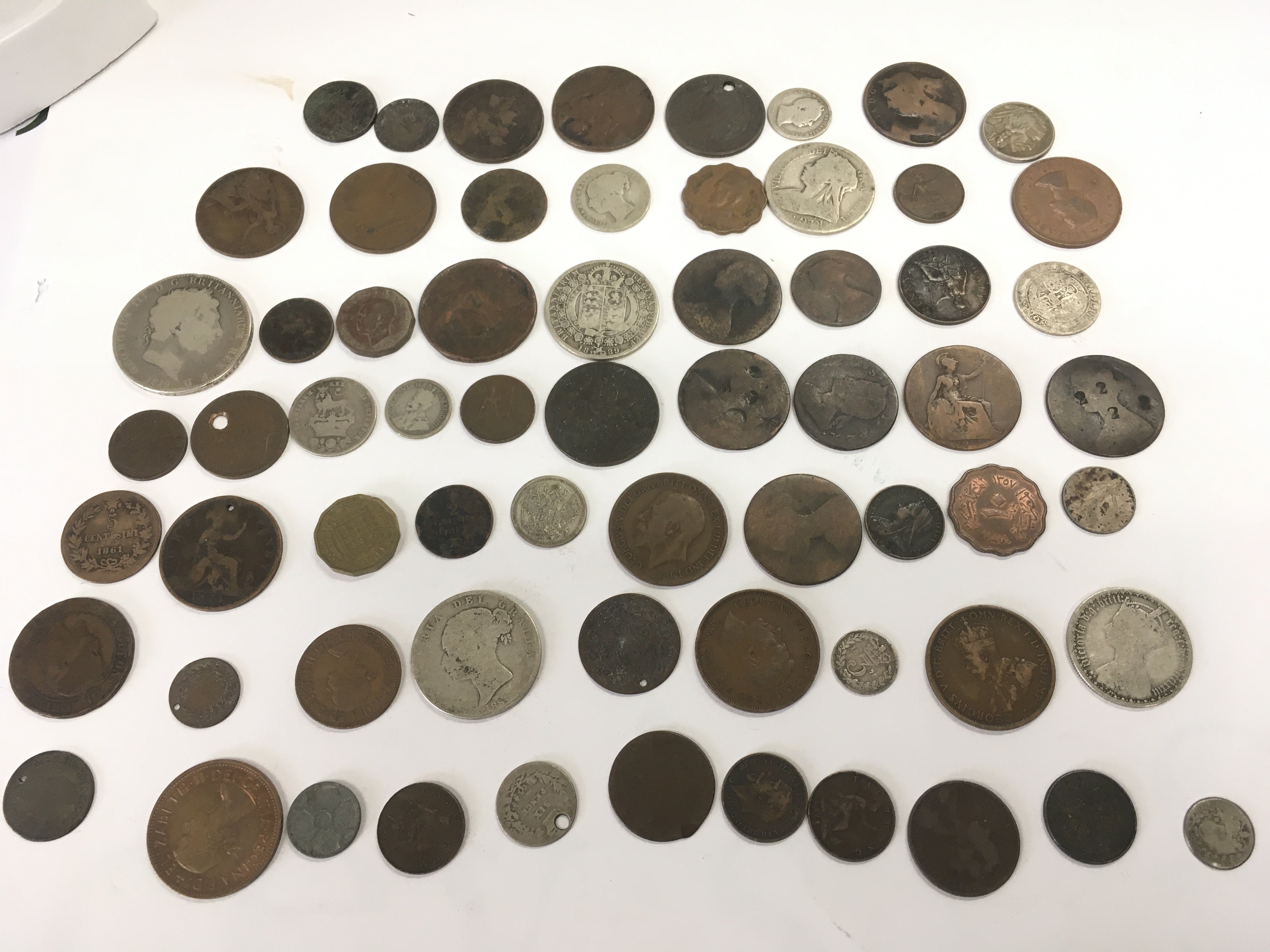 A small collection of coins including mostly British and other . Postage category A