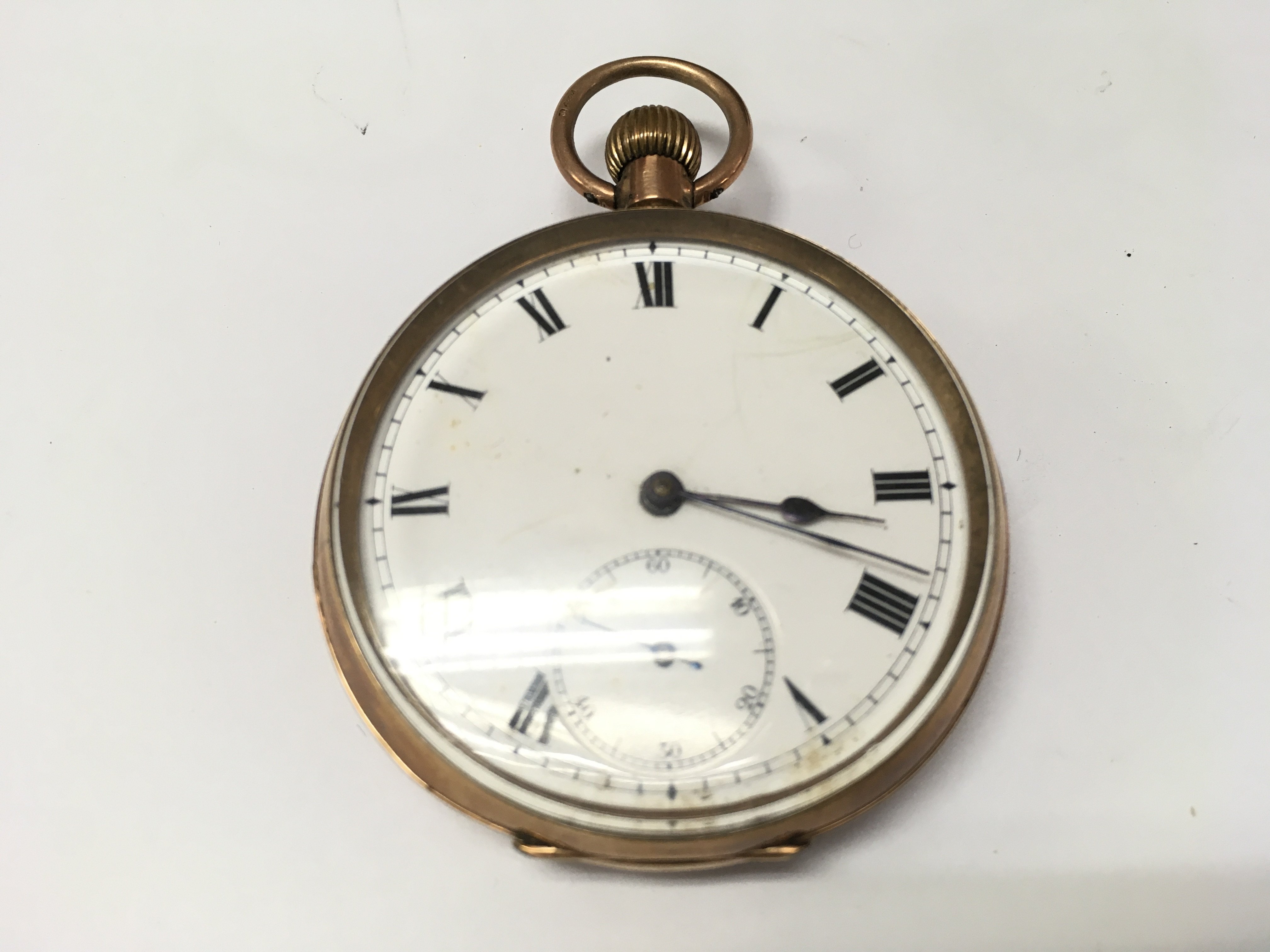 A 9ct gold button wind pocket watch. Not winding or running. 85.35g total.