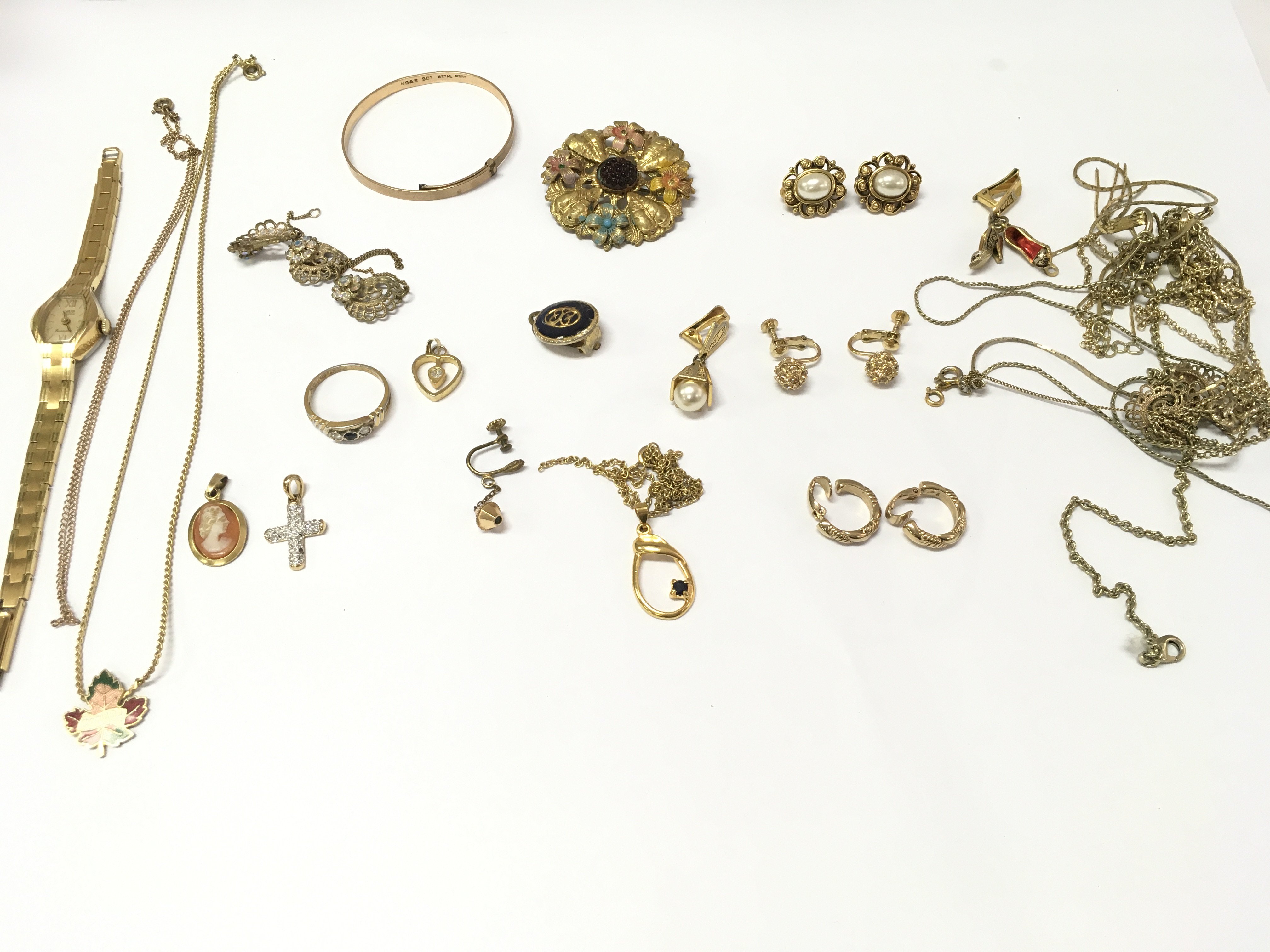 A collection of assorted gold tone jewellery.