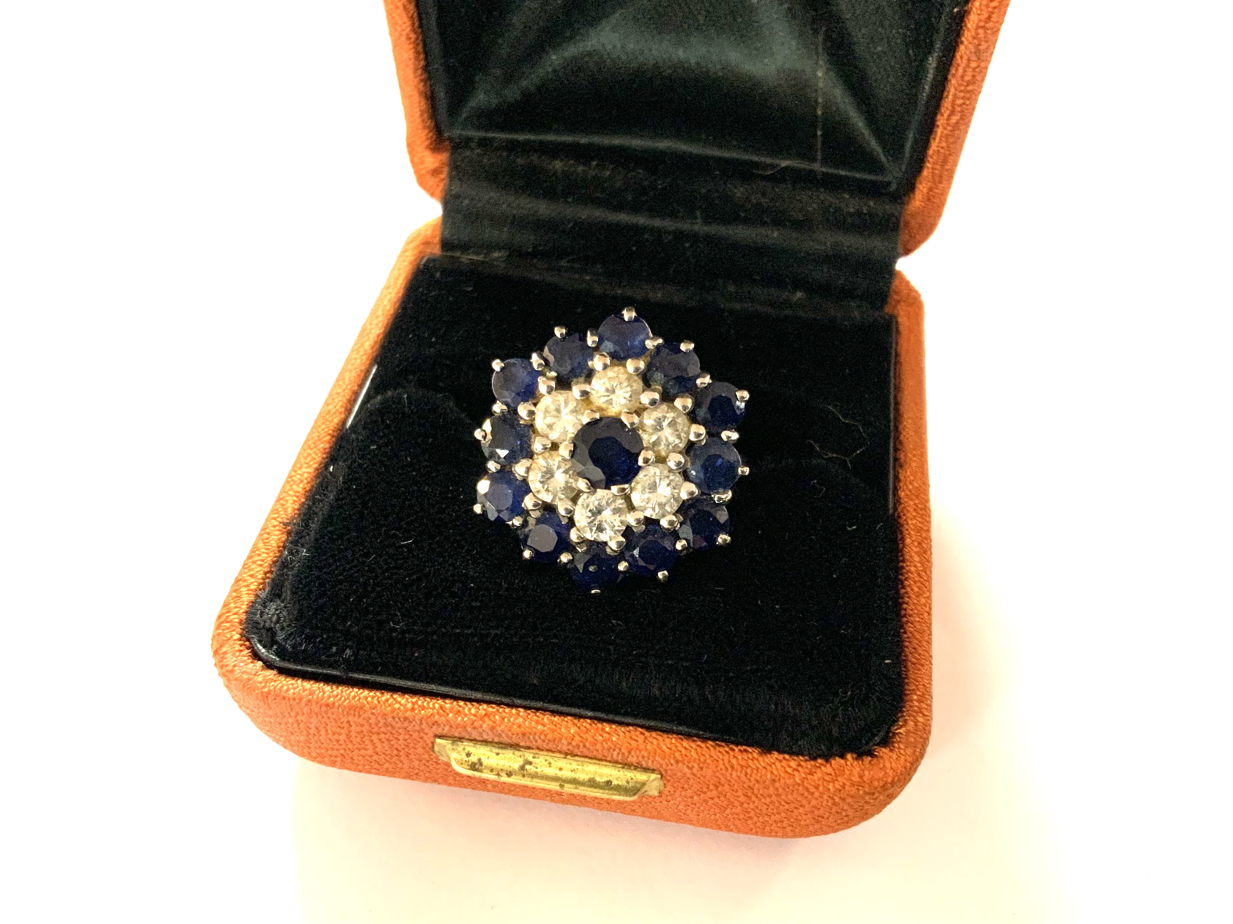 A fine 18ct white gold sapphire and diamond cluster ring. Size O. (From the Estate of the late Alderman L Miles).