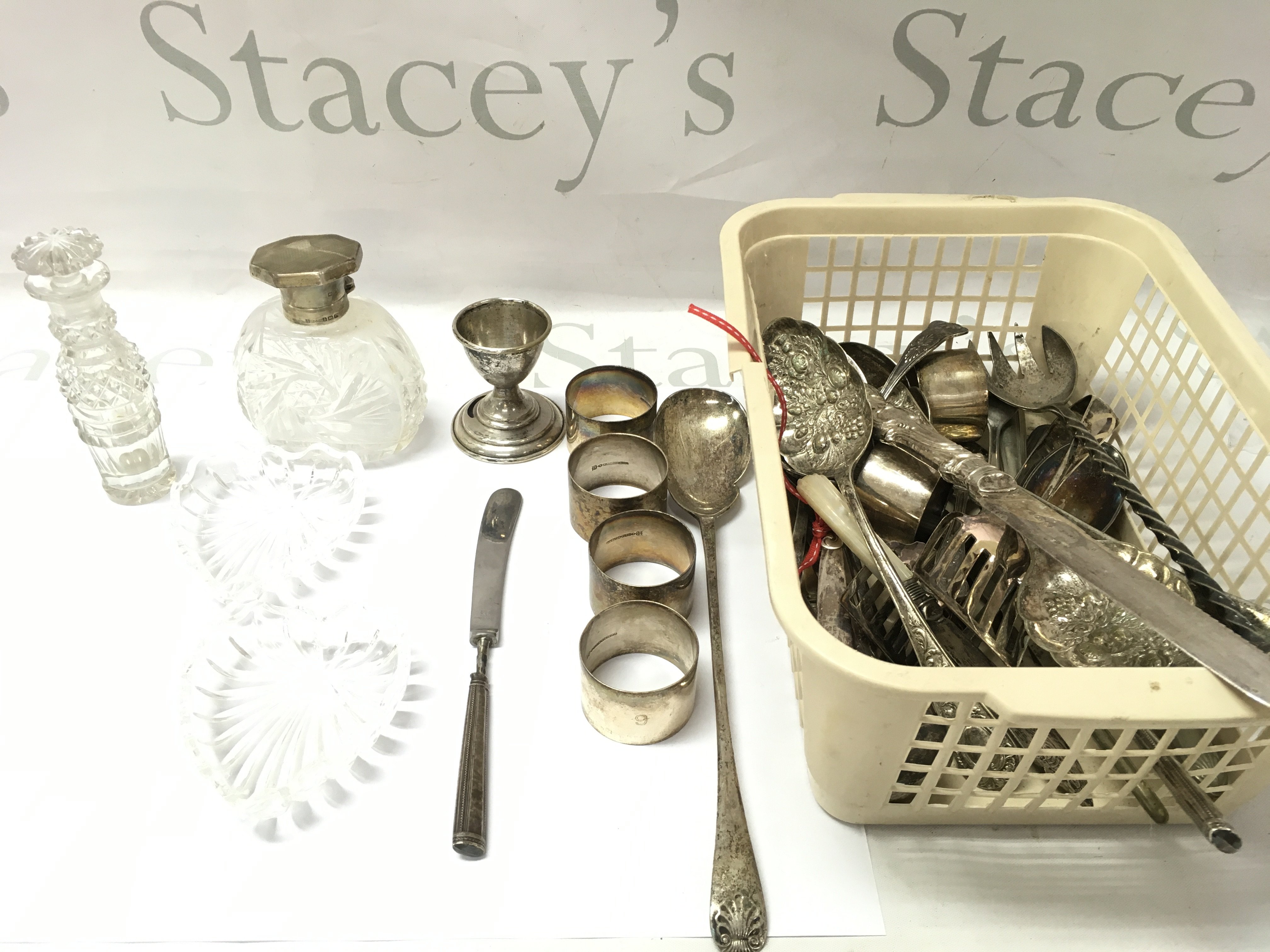 A collection of sorted silver and silver plate items and other items including silver topped glass bottle. Postage B