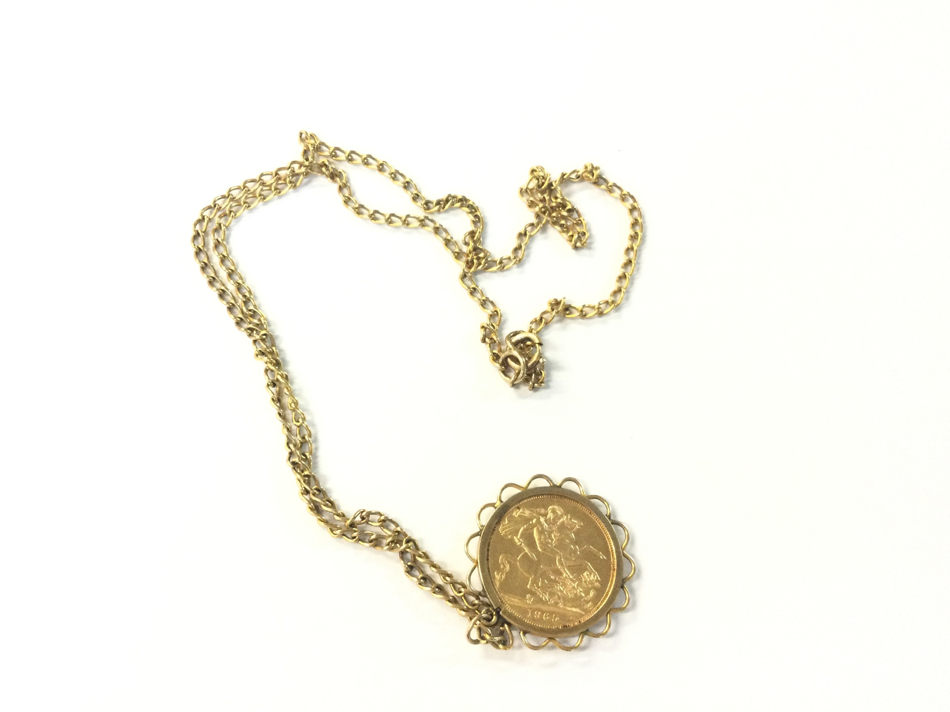 Queen Elizabeth II 1965 gold full sovereign, in a 9 karat gold mount and chain. 16.95g.