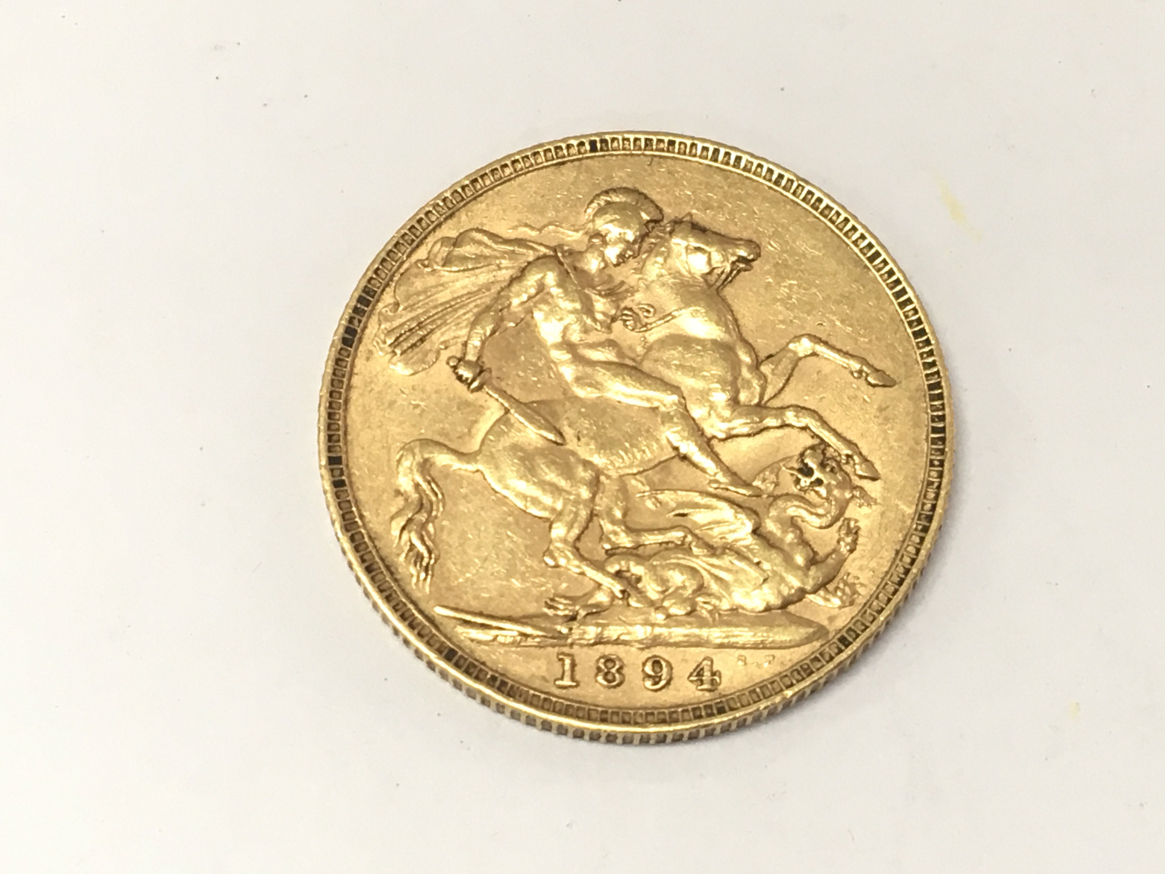 An 1894 full sovereign. Postage A