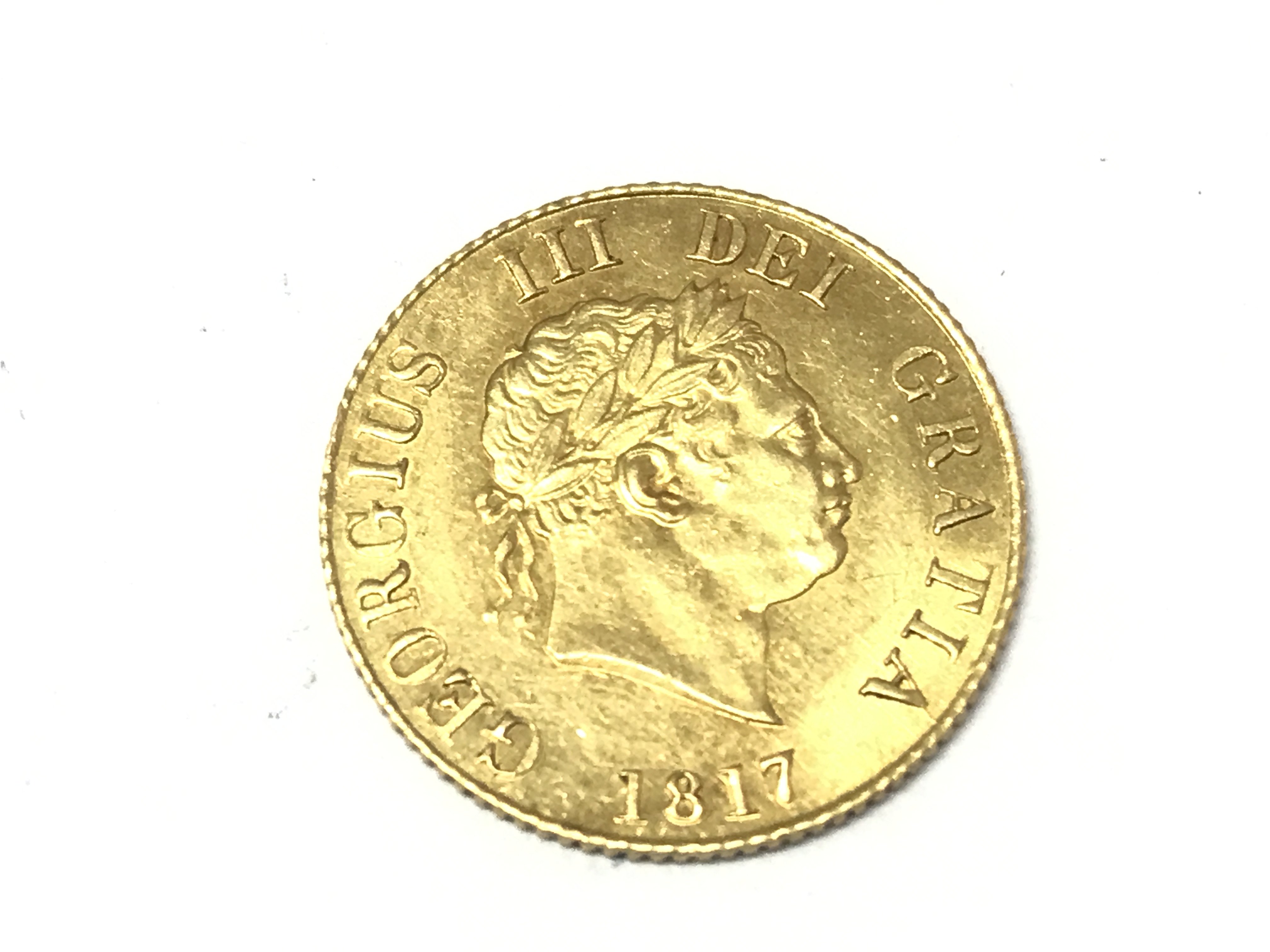 A 1817 half sovereign in very nice condition. Postage A