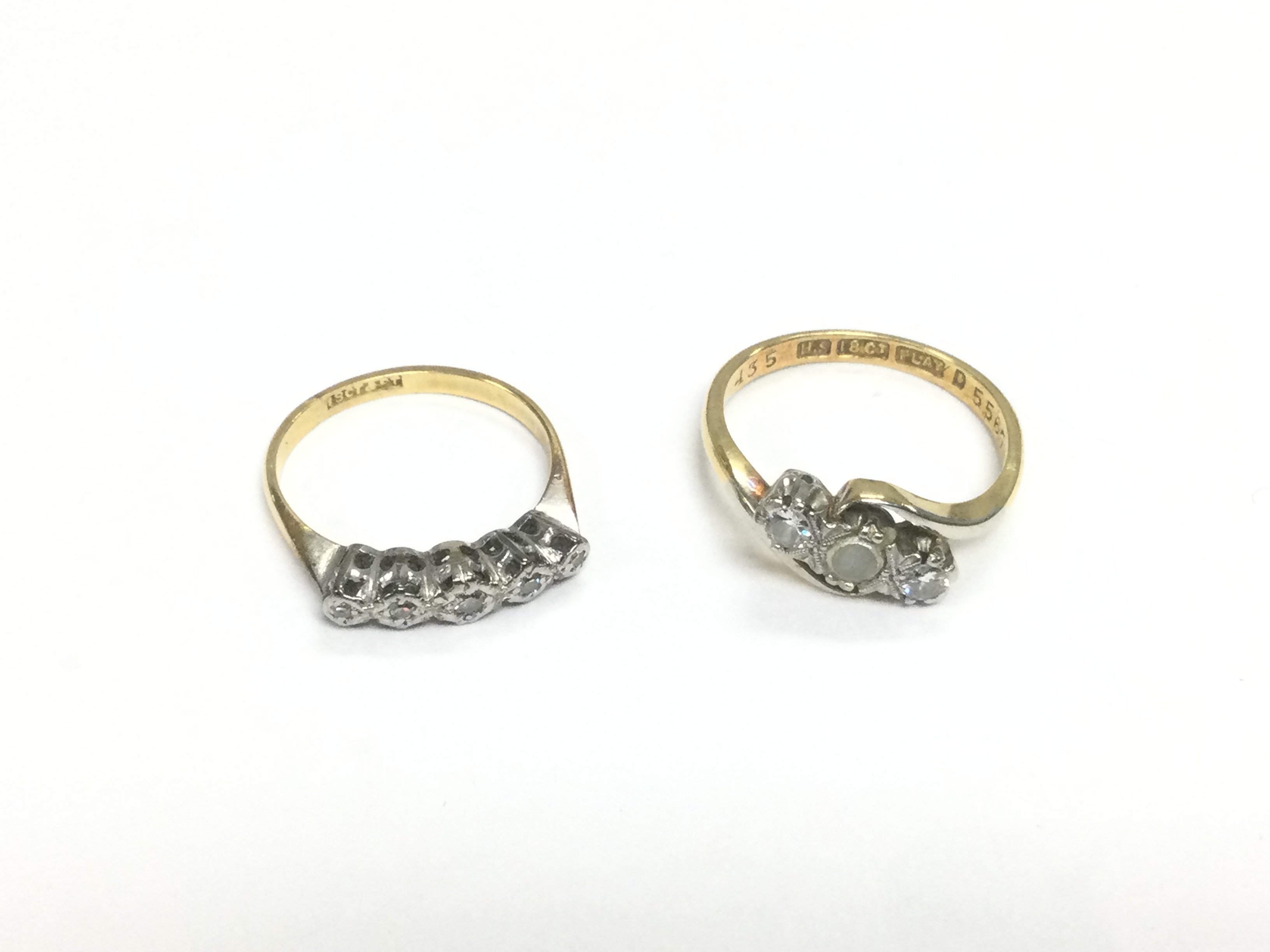 Two 18ct gold and platinum rings set with small diamonds, total approx 5g. Shipping category A.
