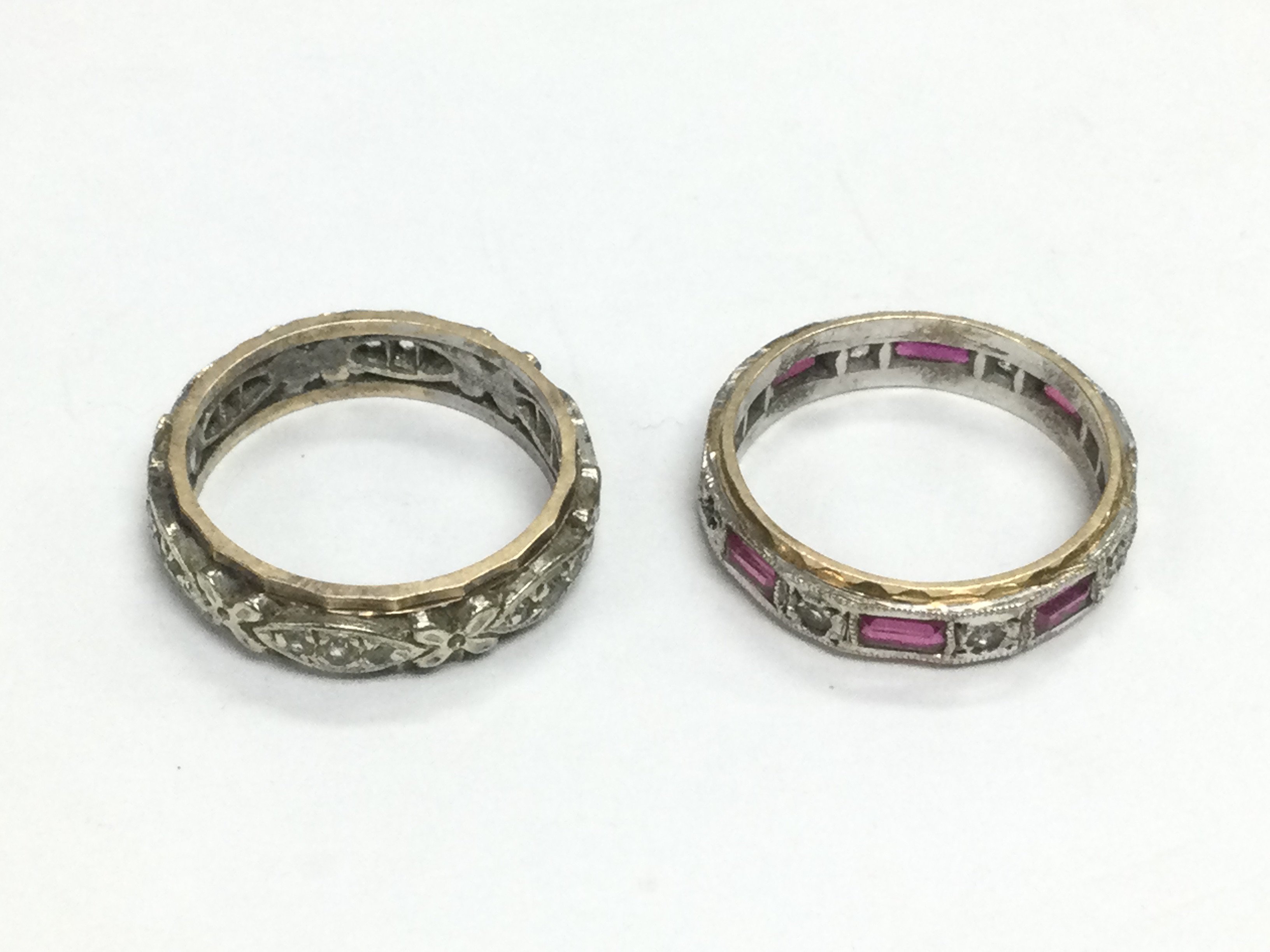 Two stone set eternity rings. Shipping category A.