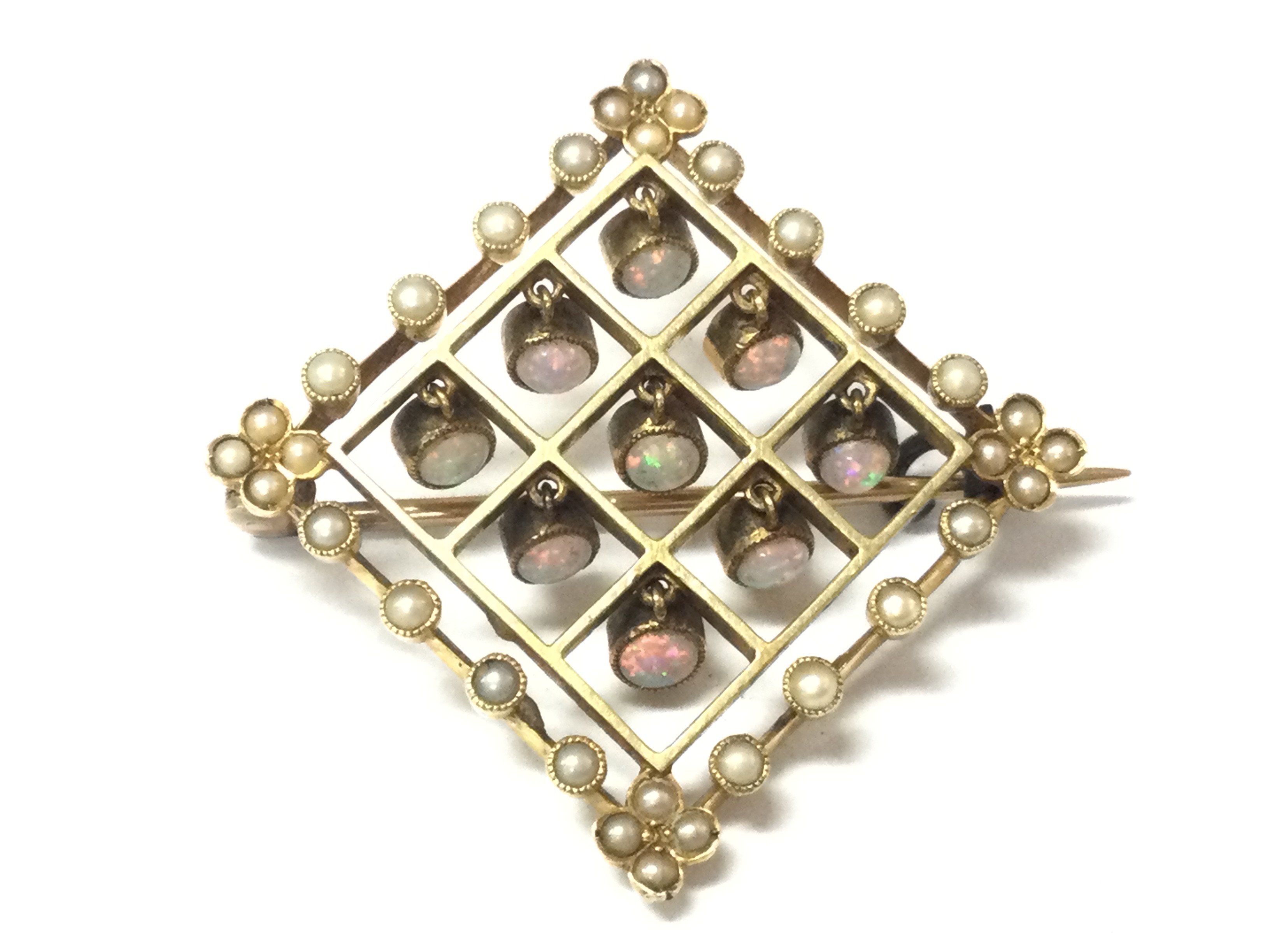 A gold opal and seed pearl set brooch. 6.25gPostage B