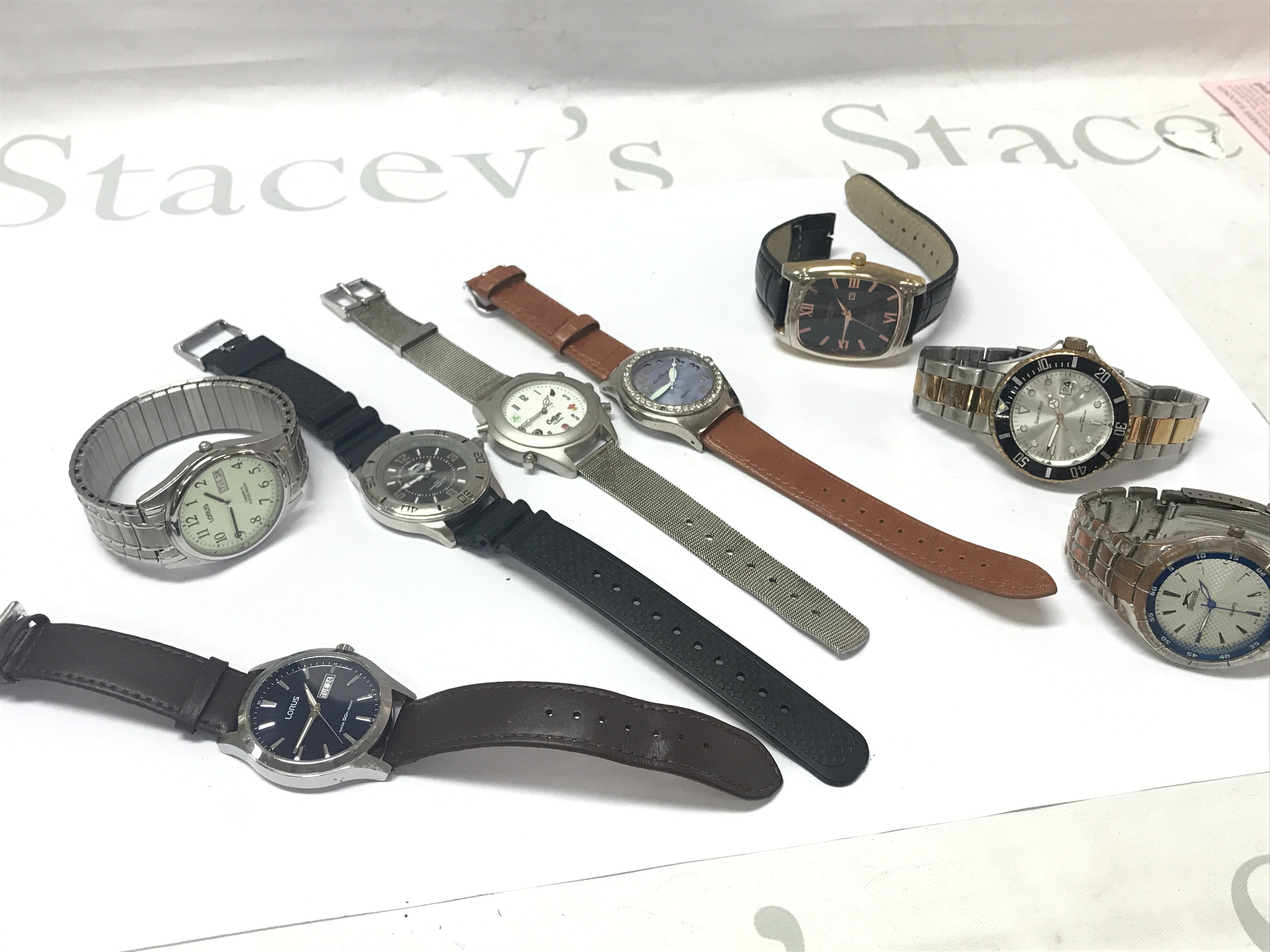 A collection of gents watches , seen in working order . Postage category B
