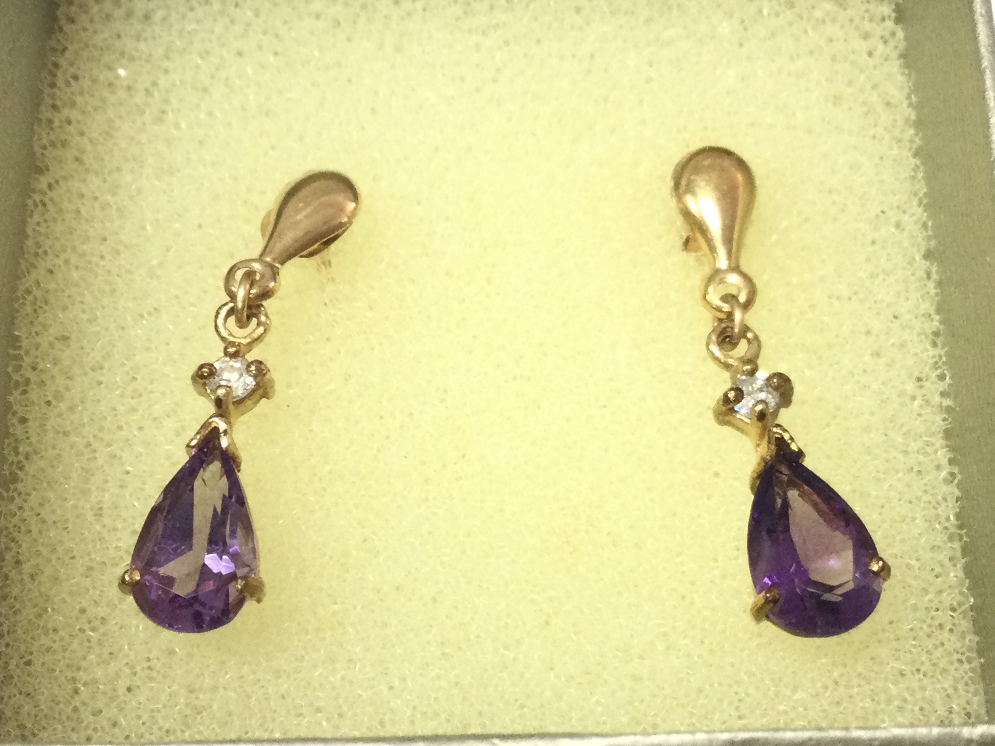 A pair of 9ct gold amethyst drop earrings. Postage B