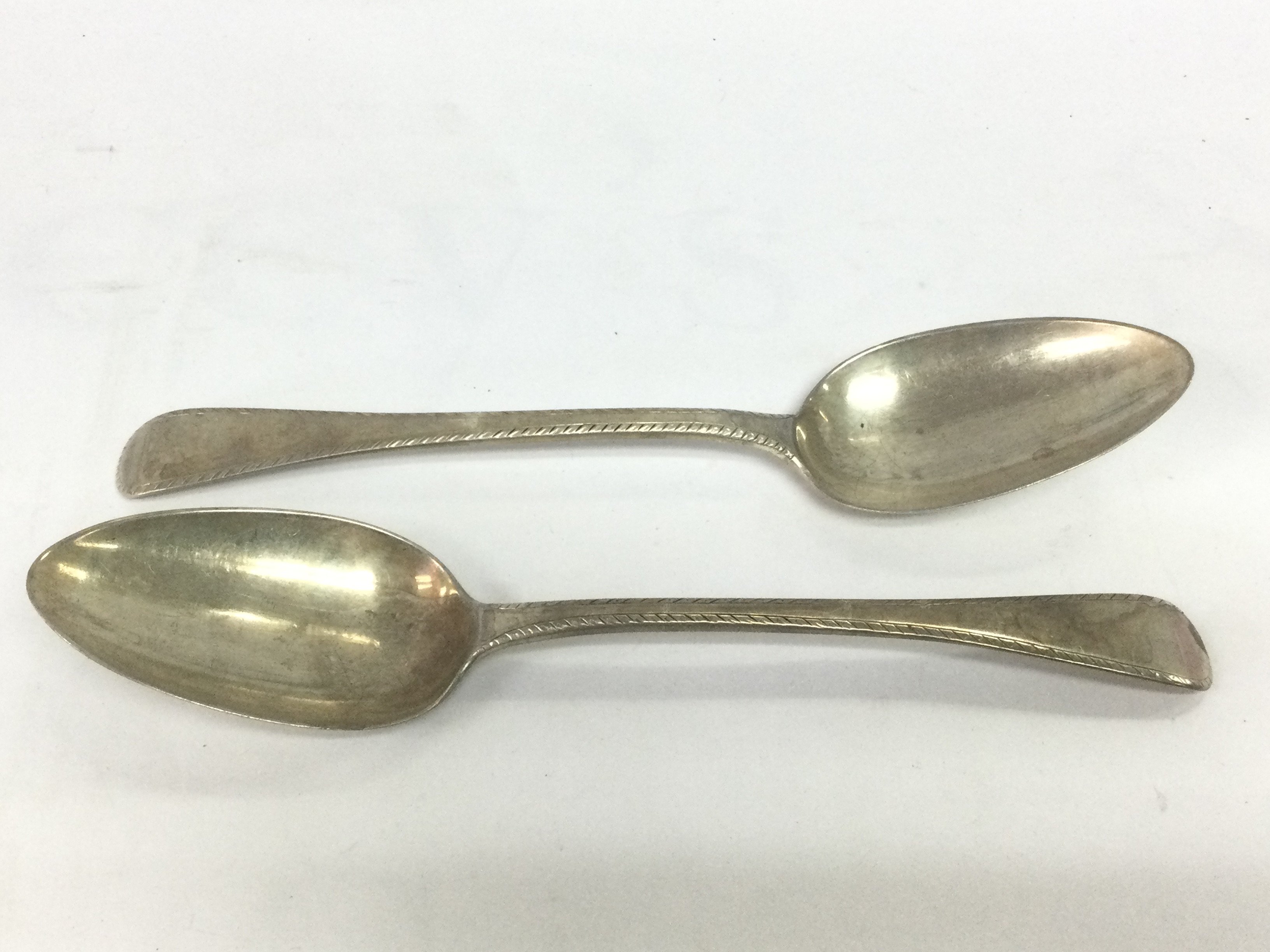A pair of Georgian silver serving spoons. Shipping category B.