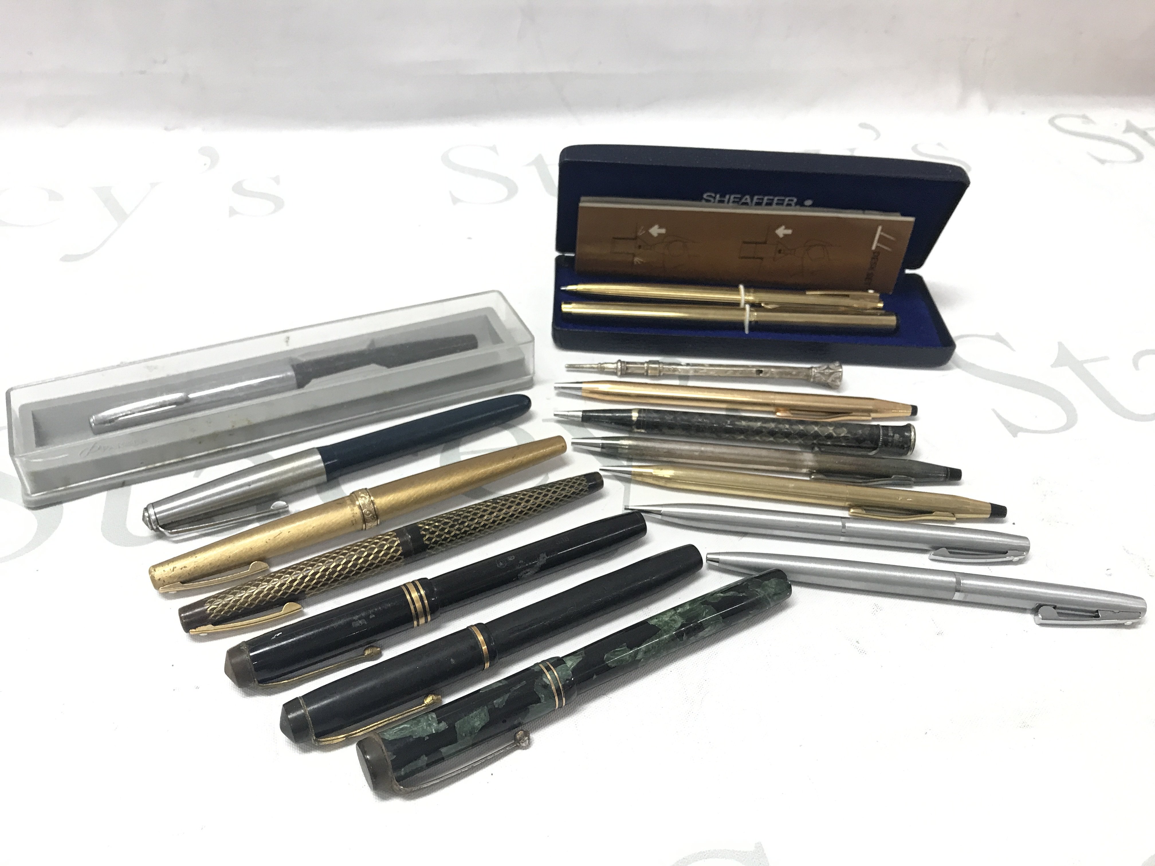 A Collection of fountain pens and pencils including 14ct gold tipped examples. Postage category B