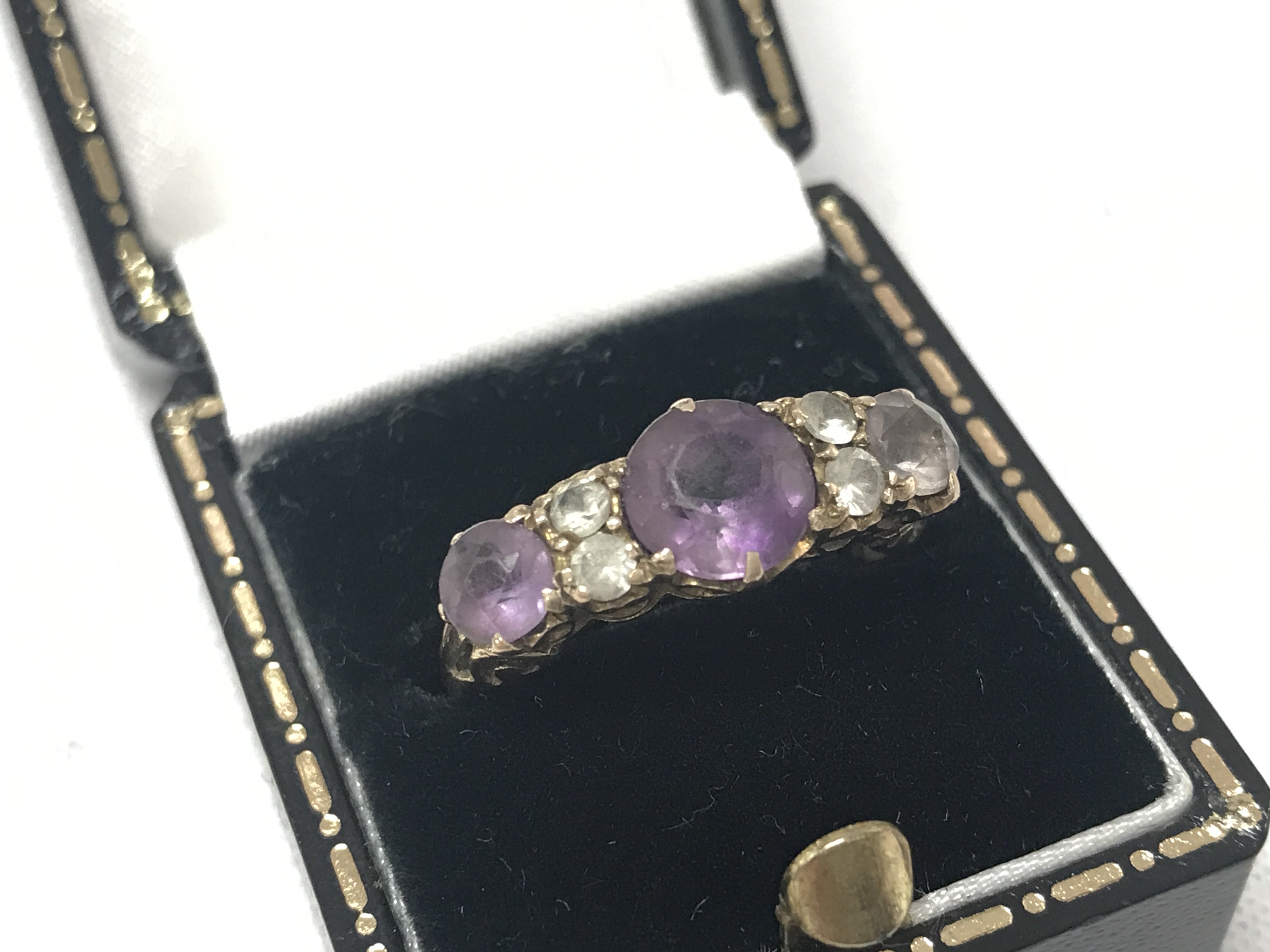 A 9ct gold amethyst and diamond ring , size N ,3.5g total weight. Postage category A