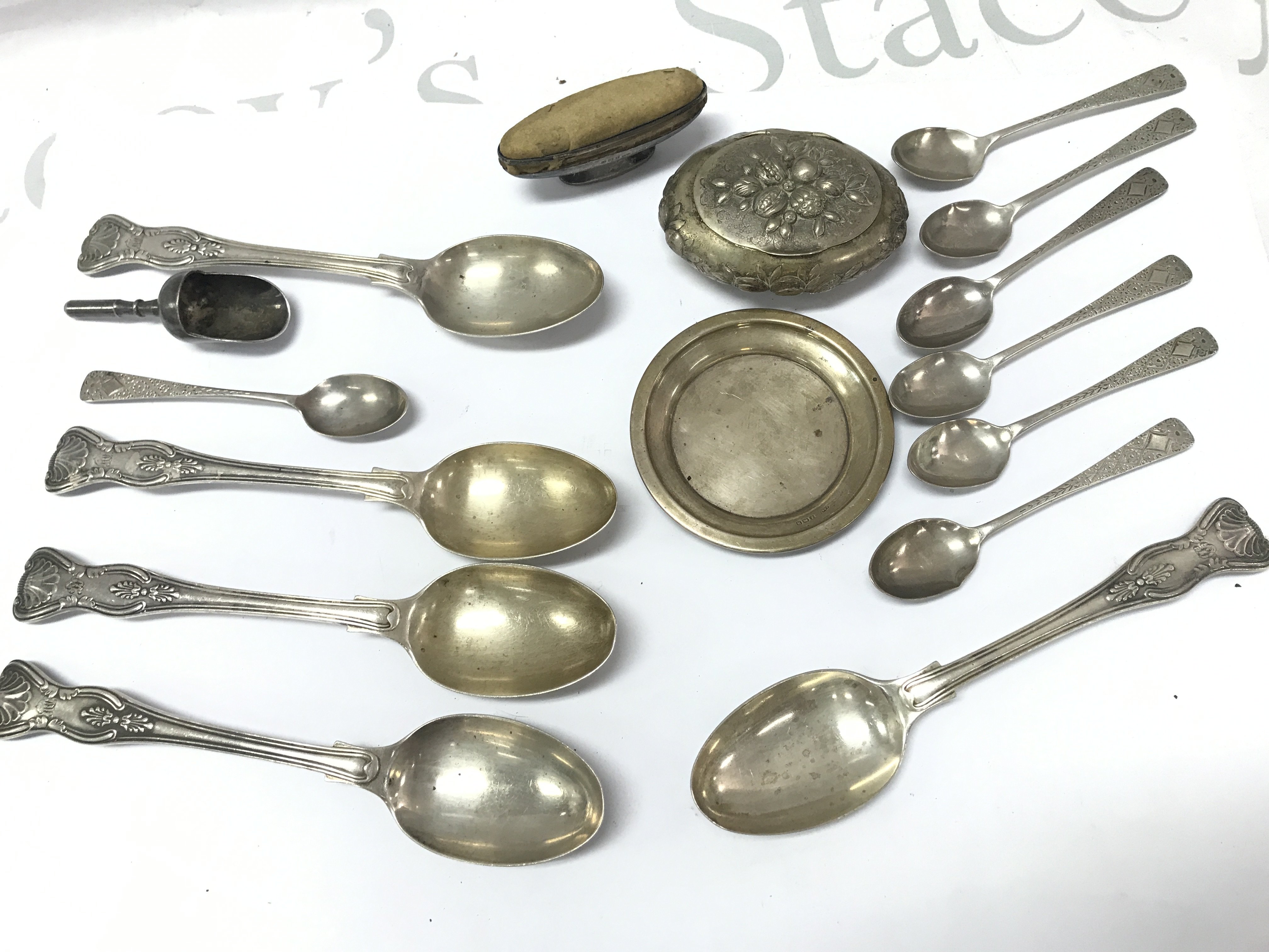 A collection of silver hallmarked spoons, dish, pin holder etc . Postage category B