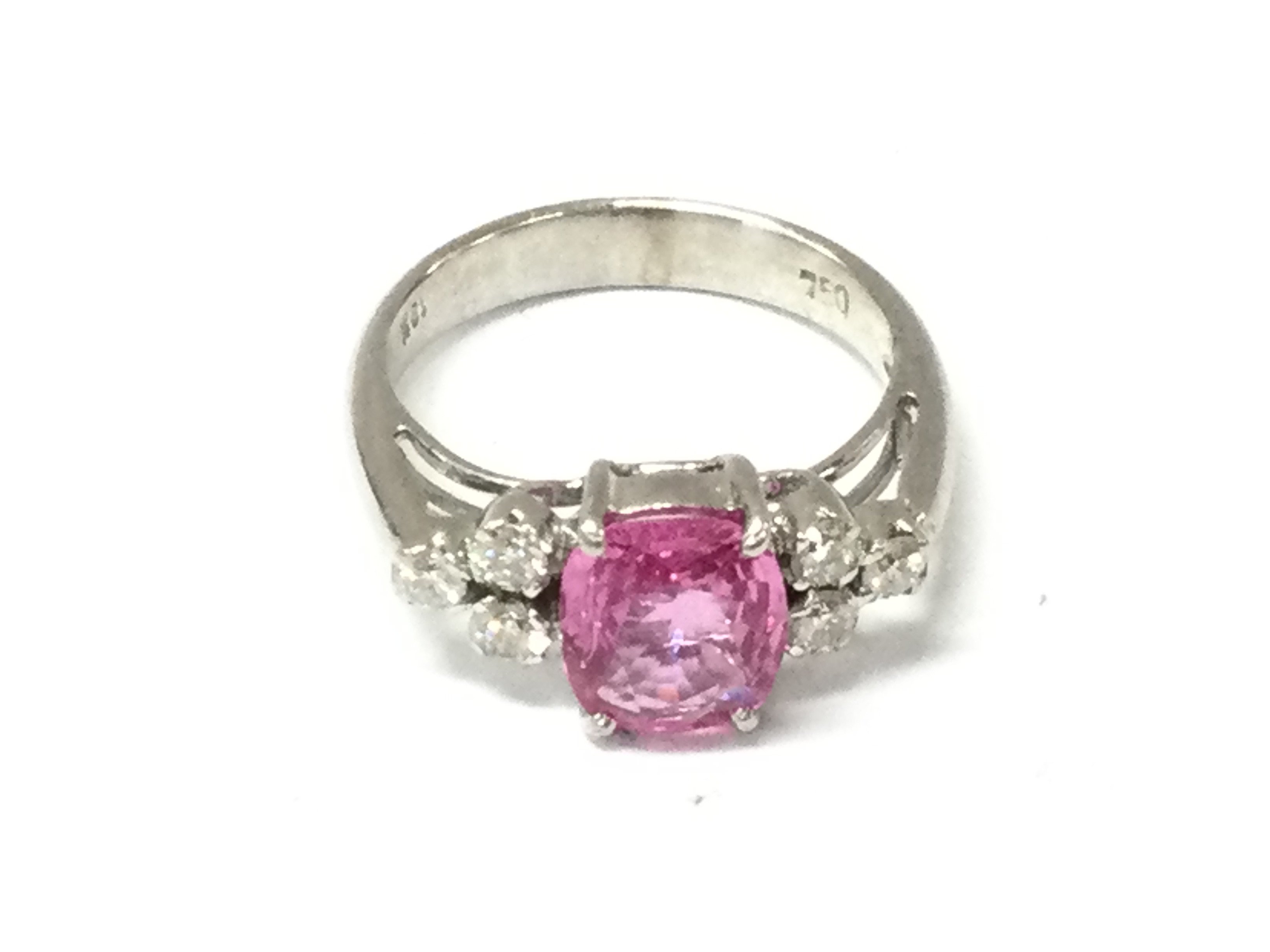 An 18ct white gold pink topaz set ring. Size N and 5.04g