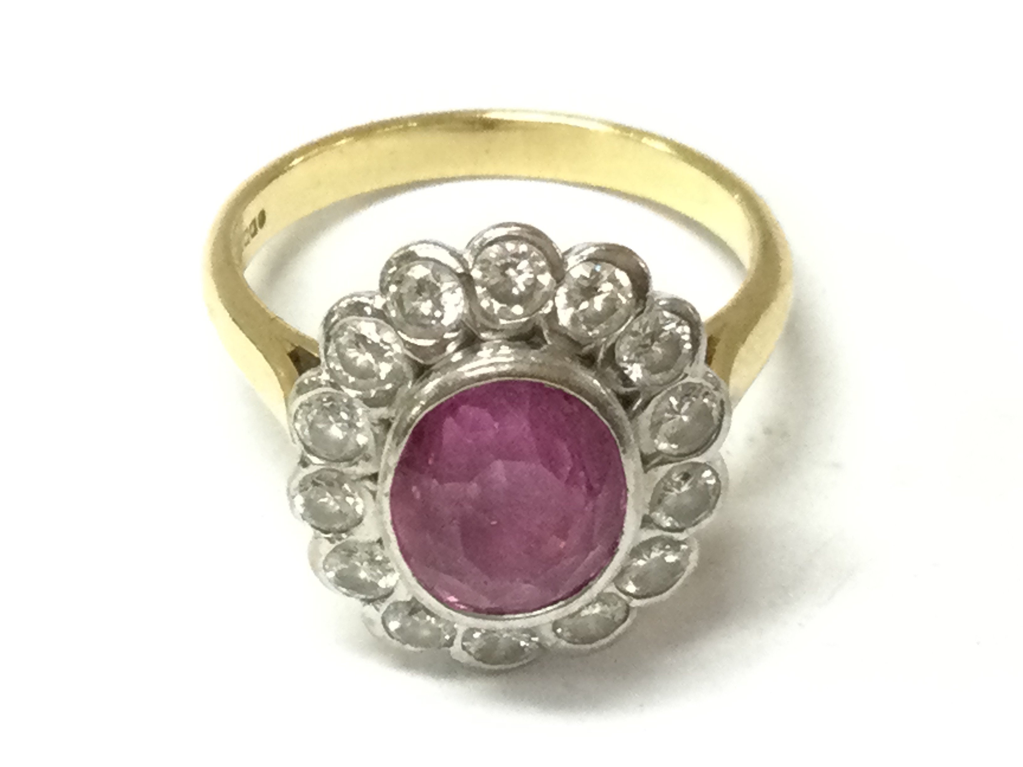 An 18ct gold ring set with pink Topaz. 6.45g and size P.