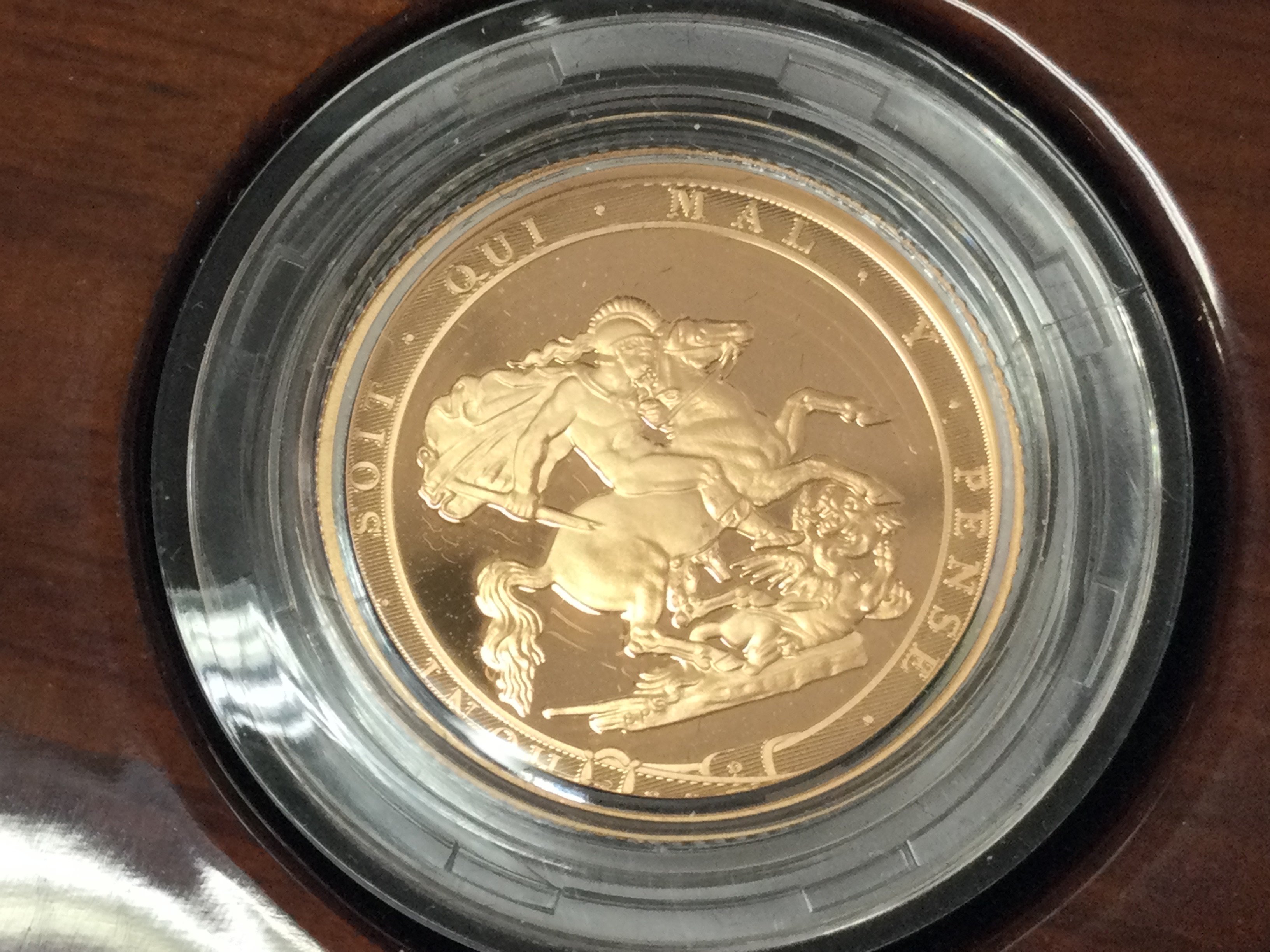 A 2017 gold proof sovereign with box and COA. Postage B