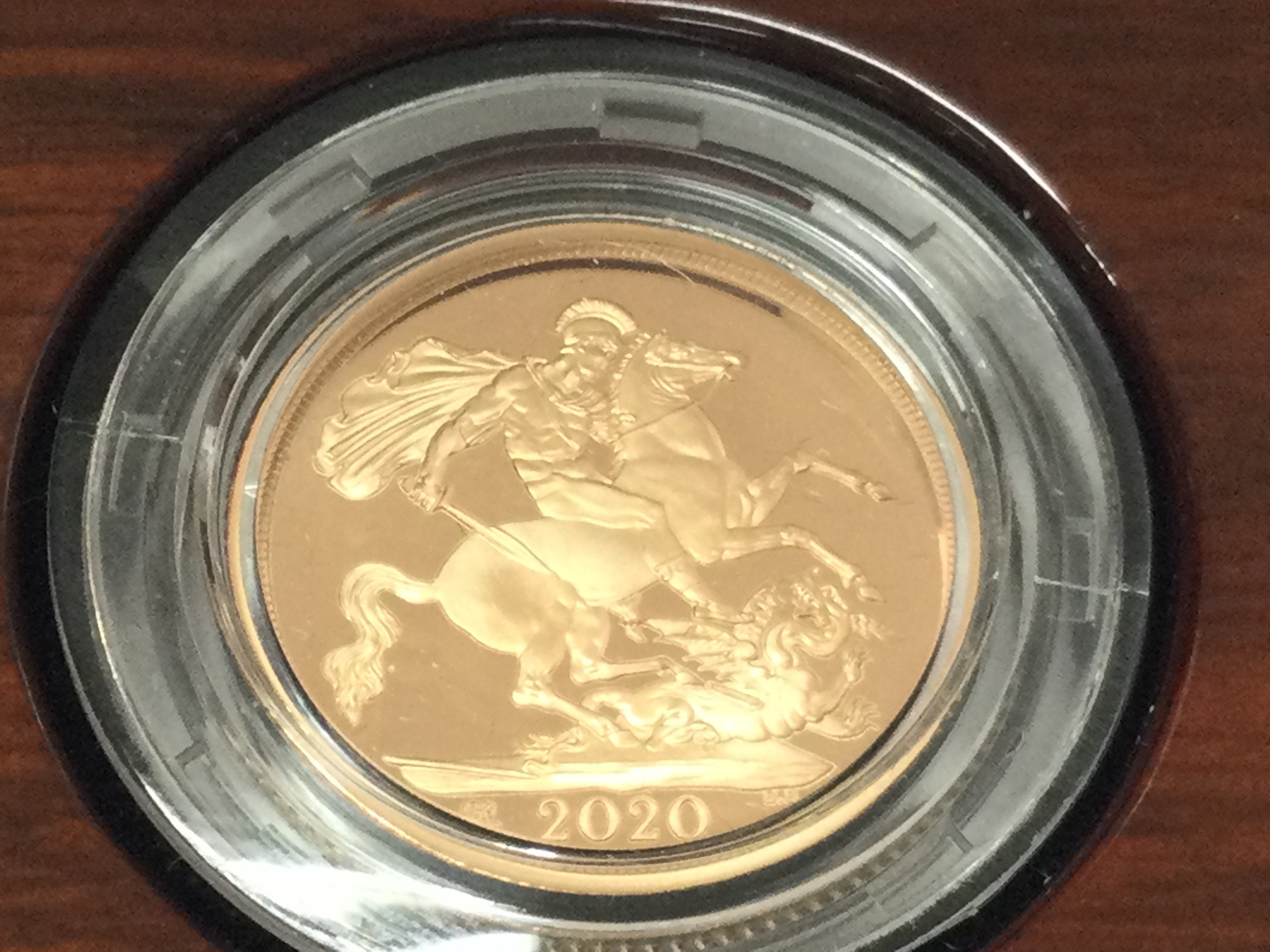 A 2020 gold proof sovereign with box and COA. Postage B