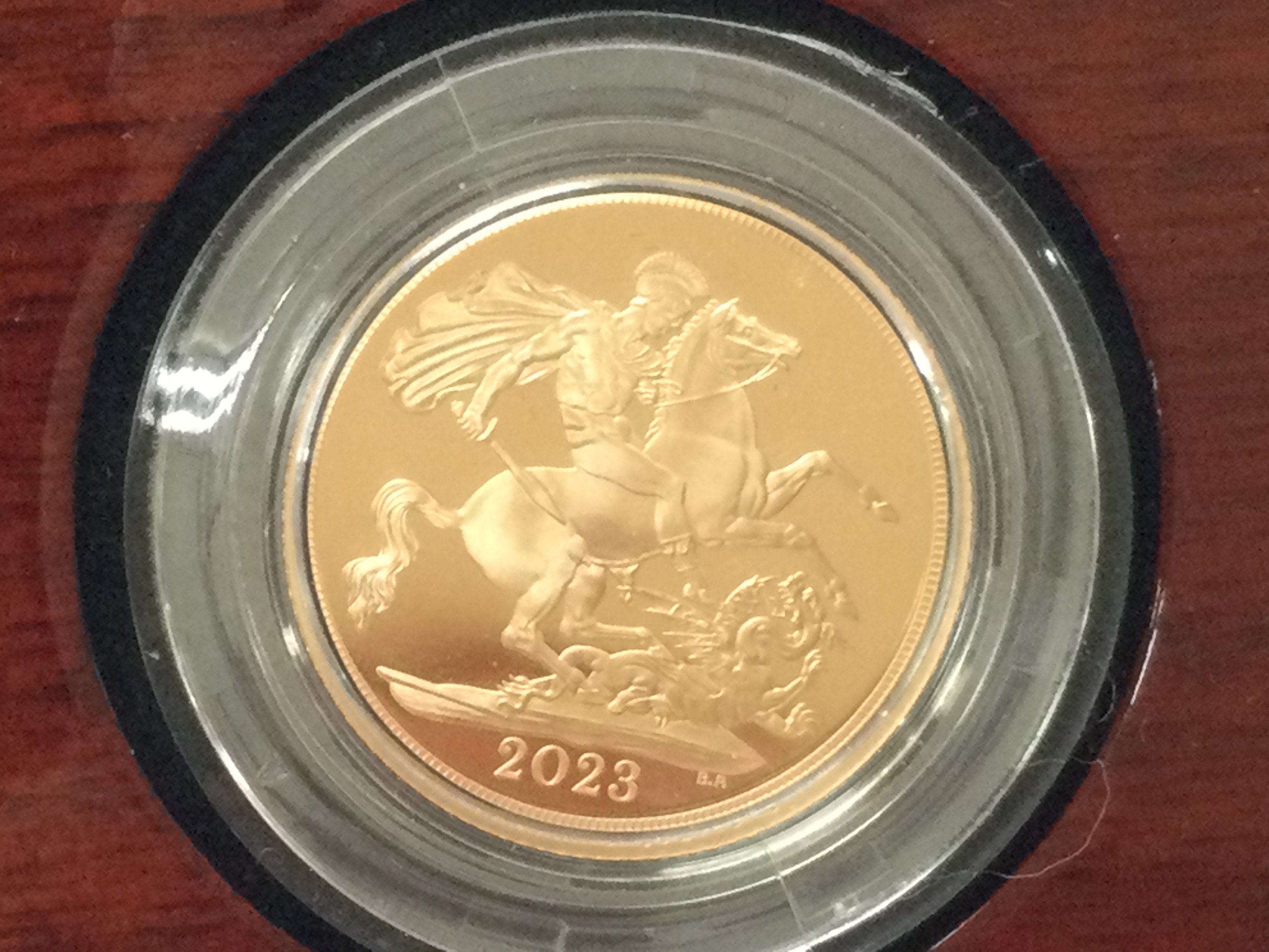 A 2023 gold proof sovereign with box and COA. Postage B