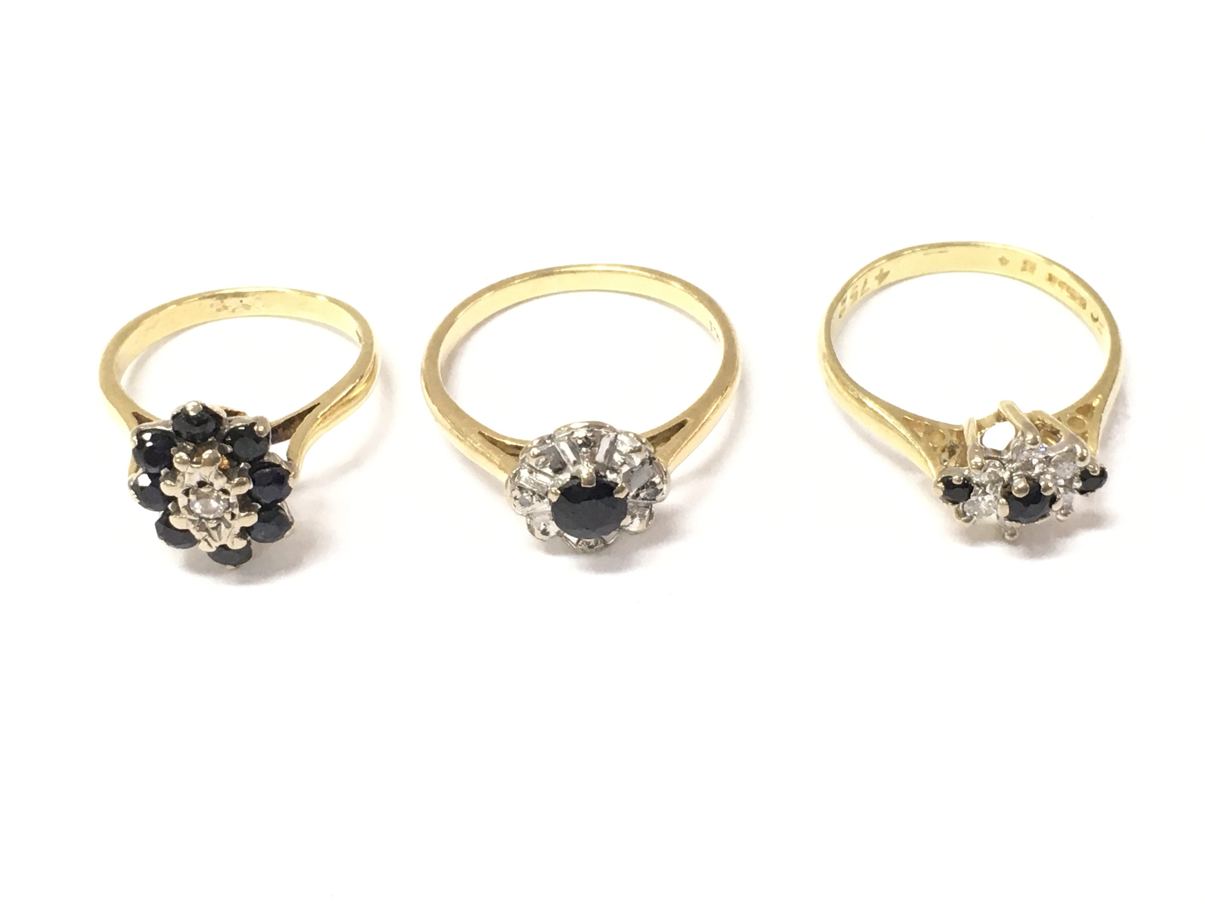 Three 18ct gold sapphire and diamond rings. One size G and other two size M. 8.3g