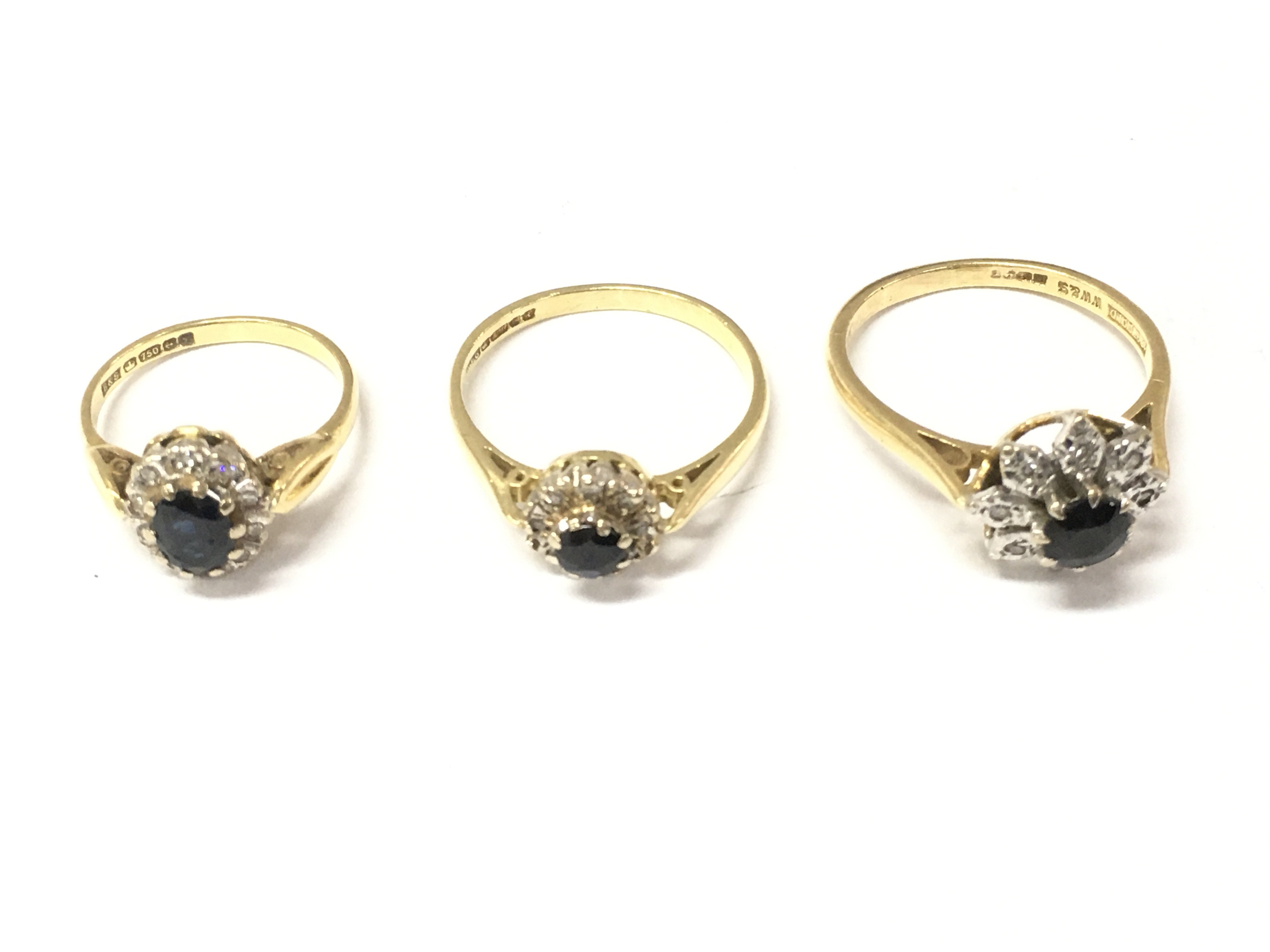 Three 18ct gold sapphire and diamond rings. Sizes G 1/2 O and Q. 9.8g Postage A