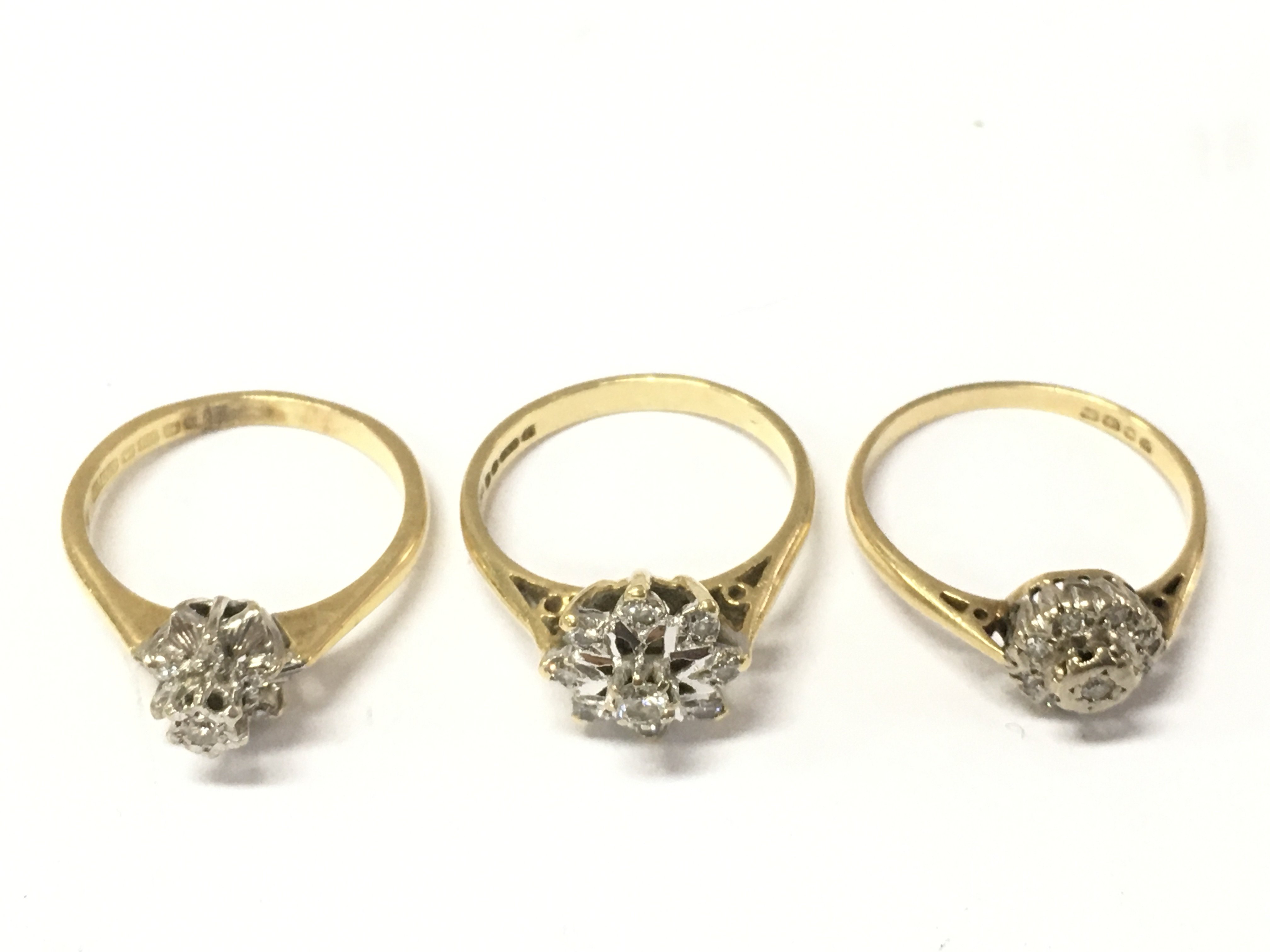 Three 18ct gold diamond rings. Size M M 1/2 and N. 9.1g Postage A