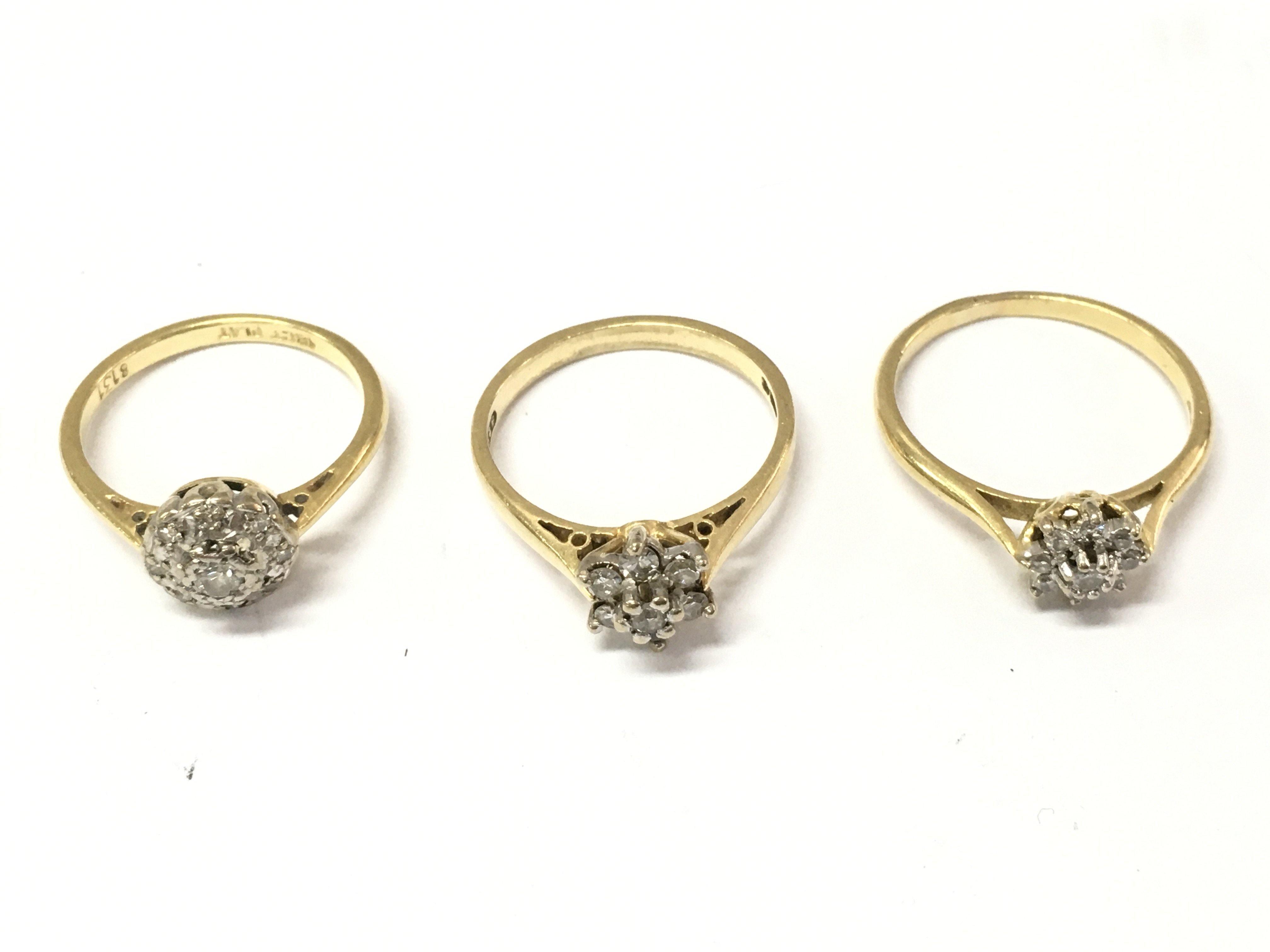 Three 18ct gold diamond cluster rings. Sizes L M and N. 8.1g