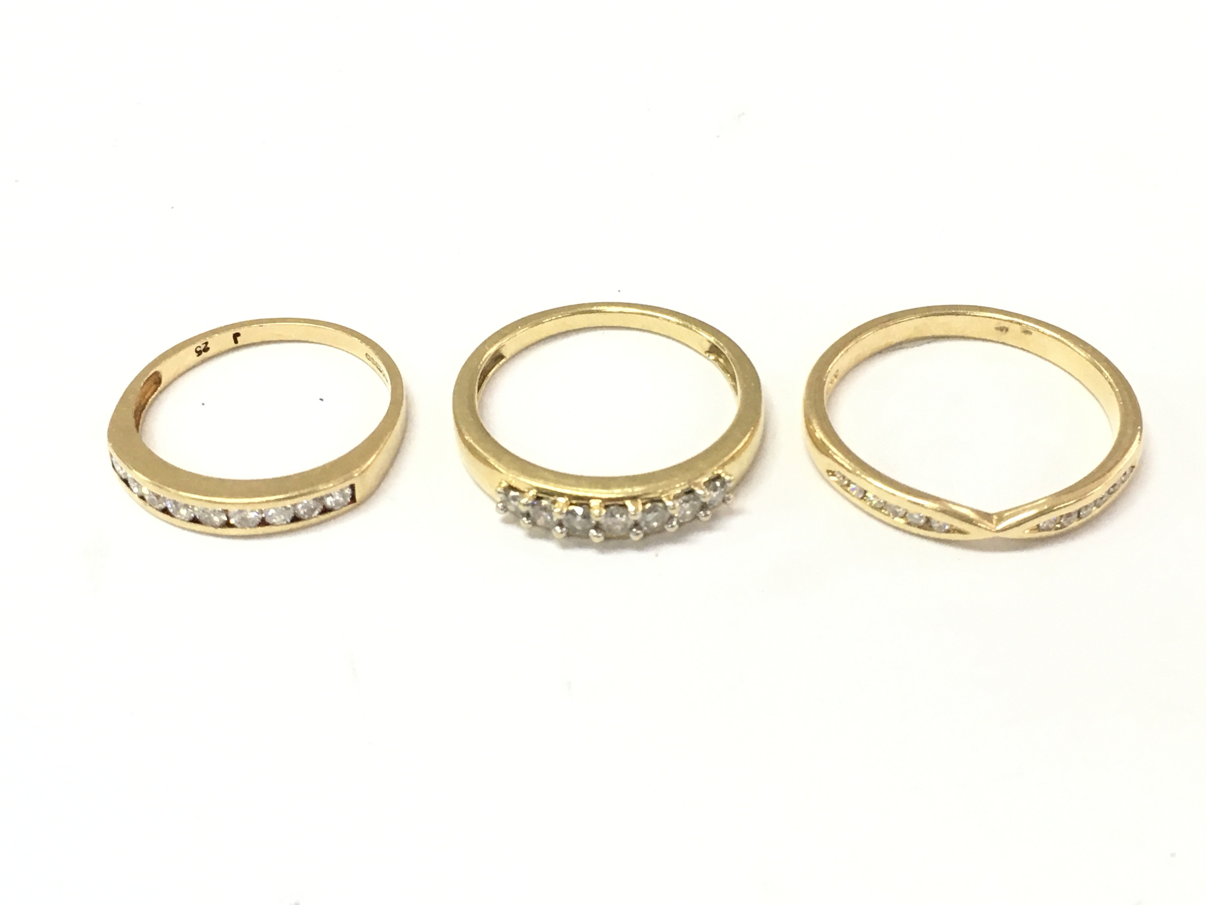 Three 18ct gold diamond 1/2 hoop rings. Size J 1/2 K 1/2 and N. 7g Postage A