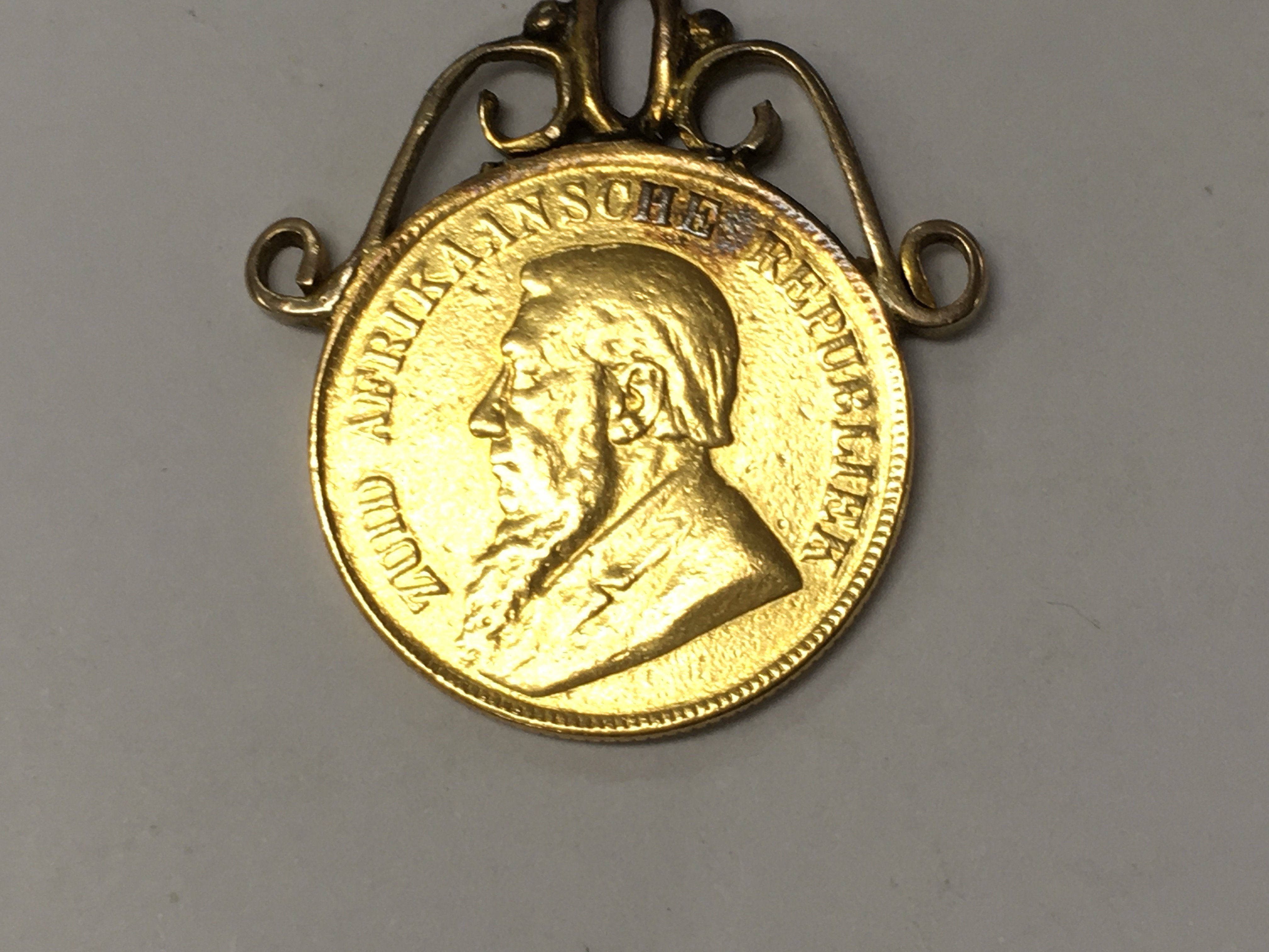 A mounted African 1898 gold coin total weight 8.9 grams