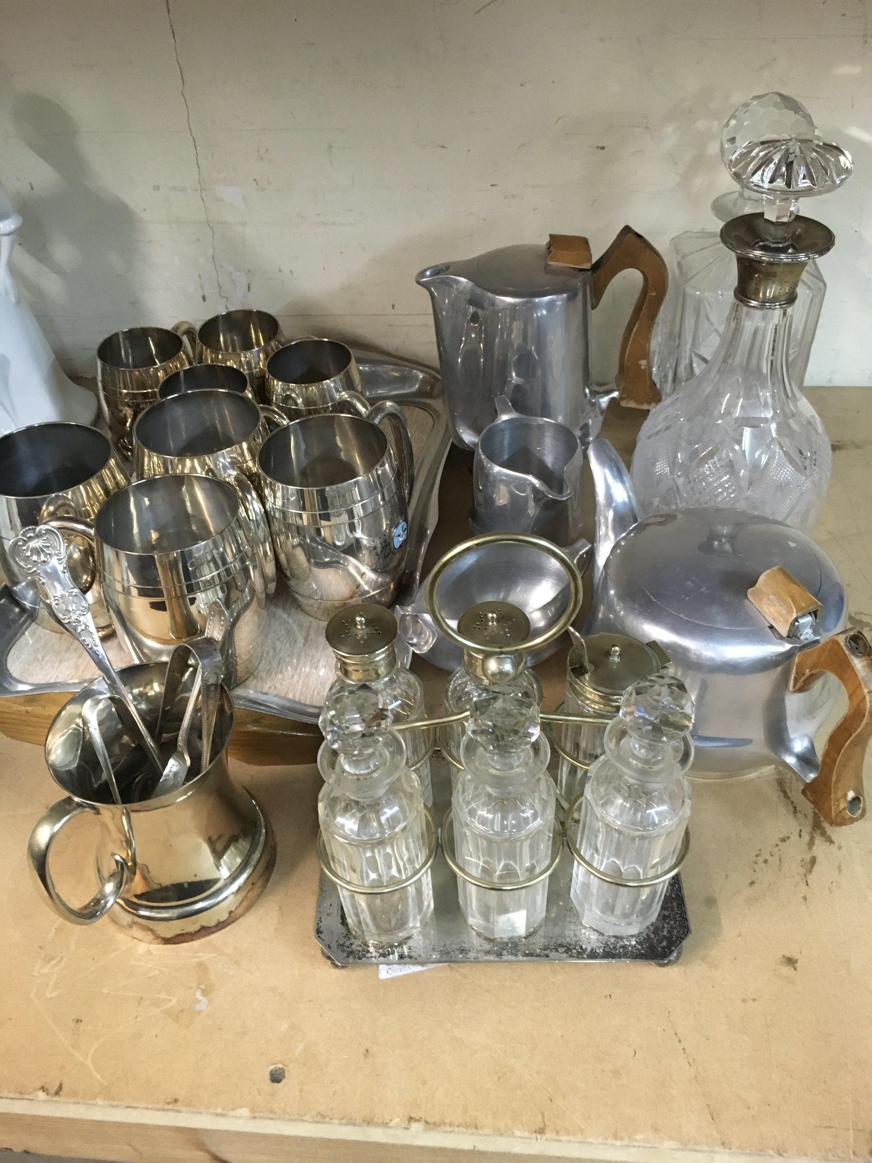 A collection of plated ware together with Picquot ware set, two Decanters One with silver collar.