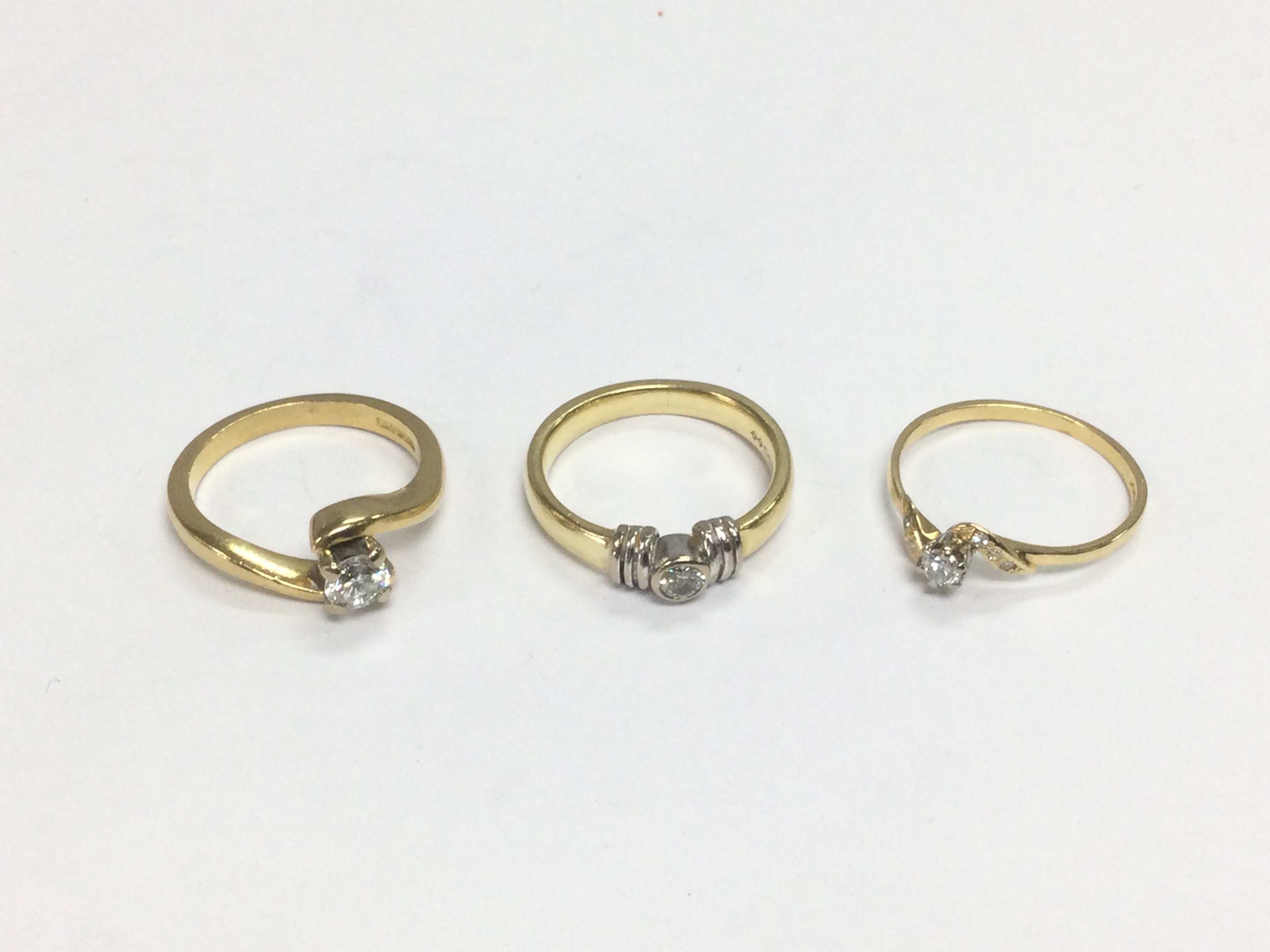 Three 18ct gold diamond solitaire rings, approx sizes J, K and K-L. Total approx 9.5g. Shipping category A.
