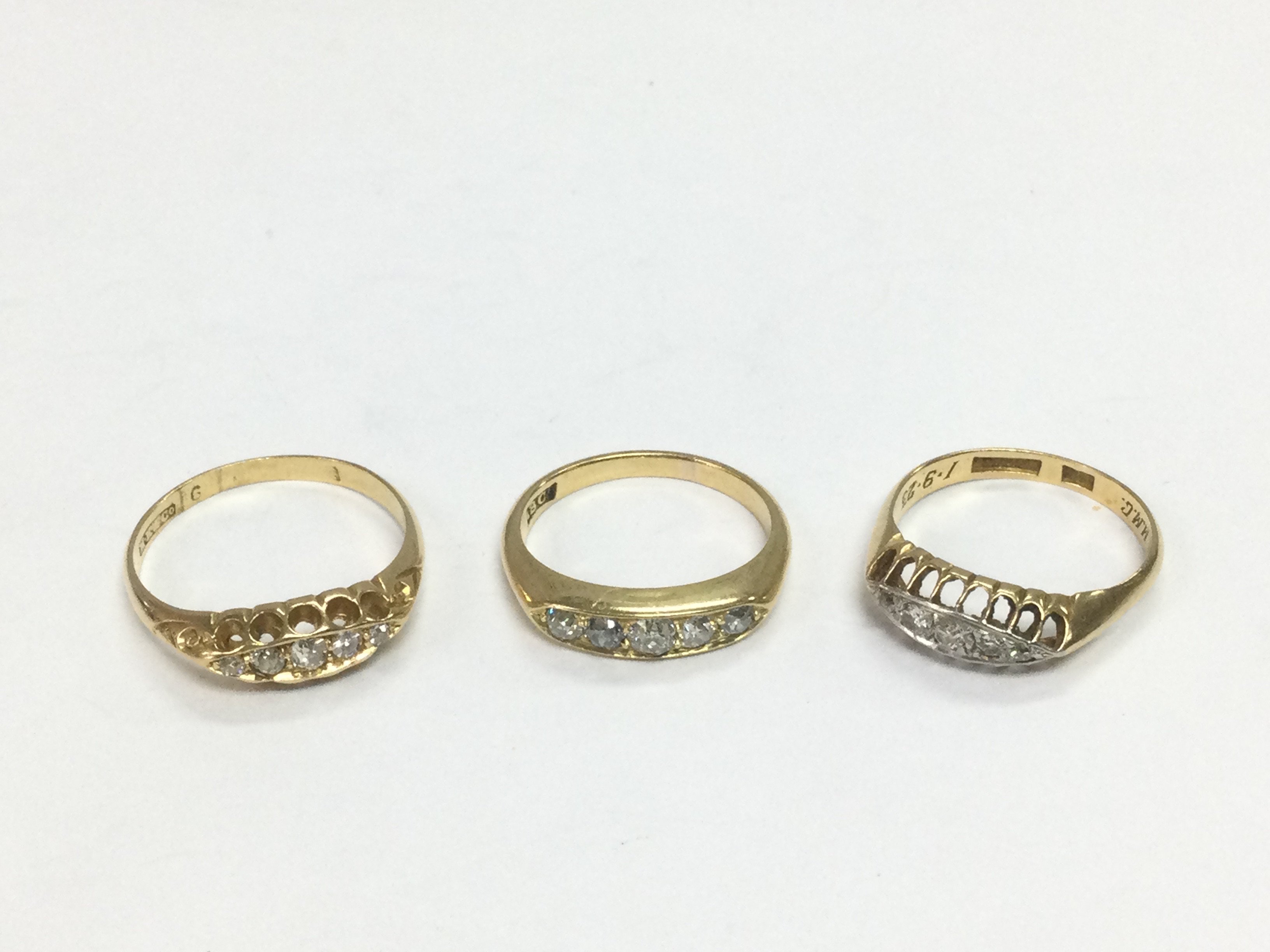 Three 18ct gold five stone diamond rings, approx sizes K, P and M. Total approx 8.9g. Shipping category A.
