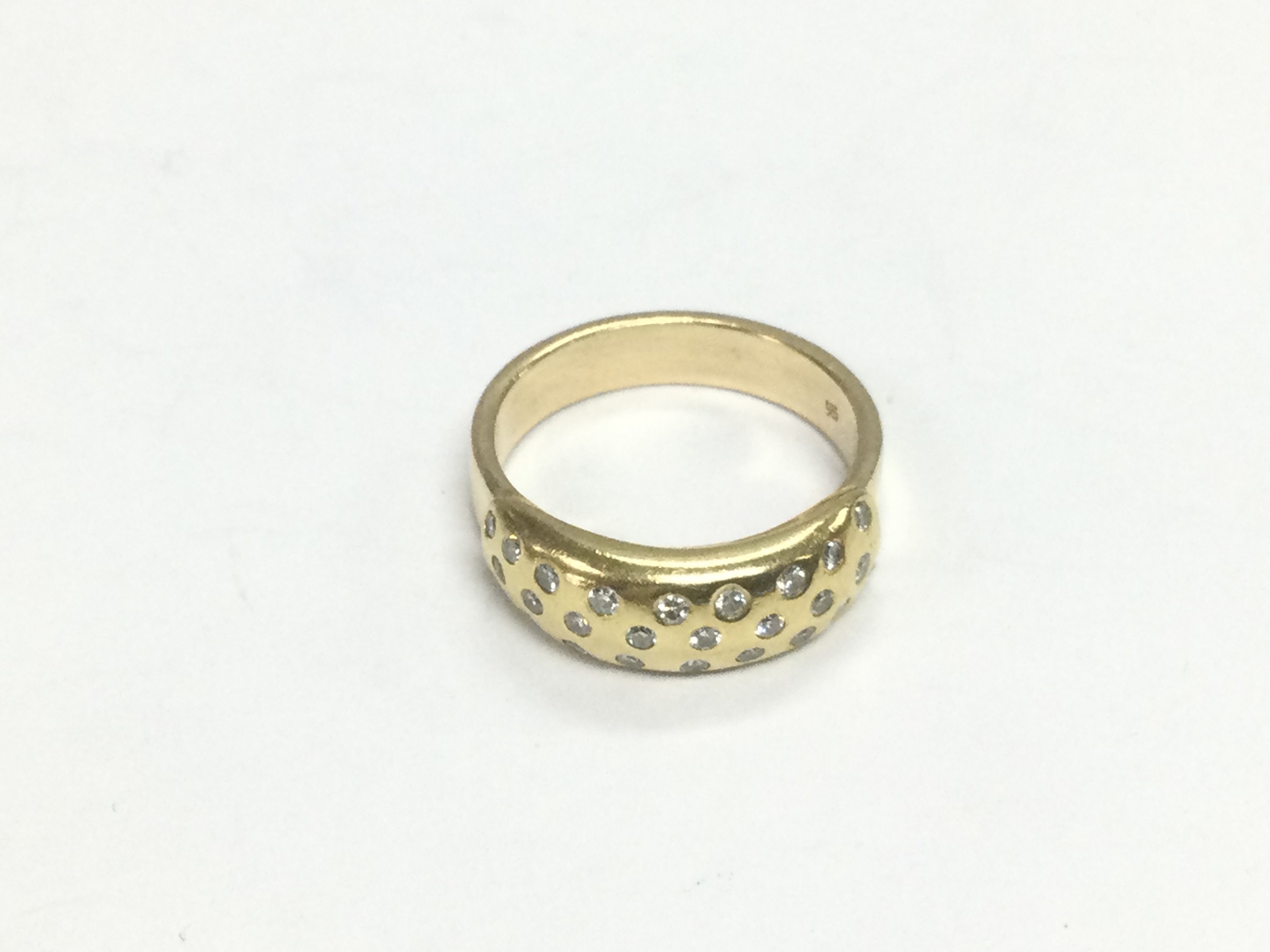 A 14ct gold ring set with diamonds, approx size M and approx 5.7g. Shipping category A.