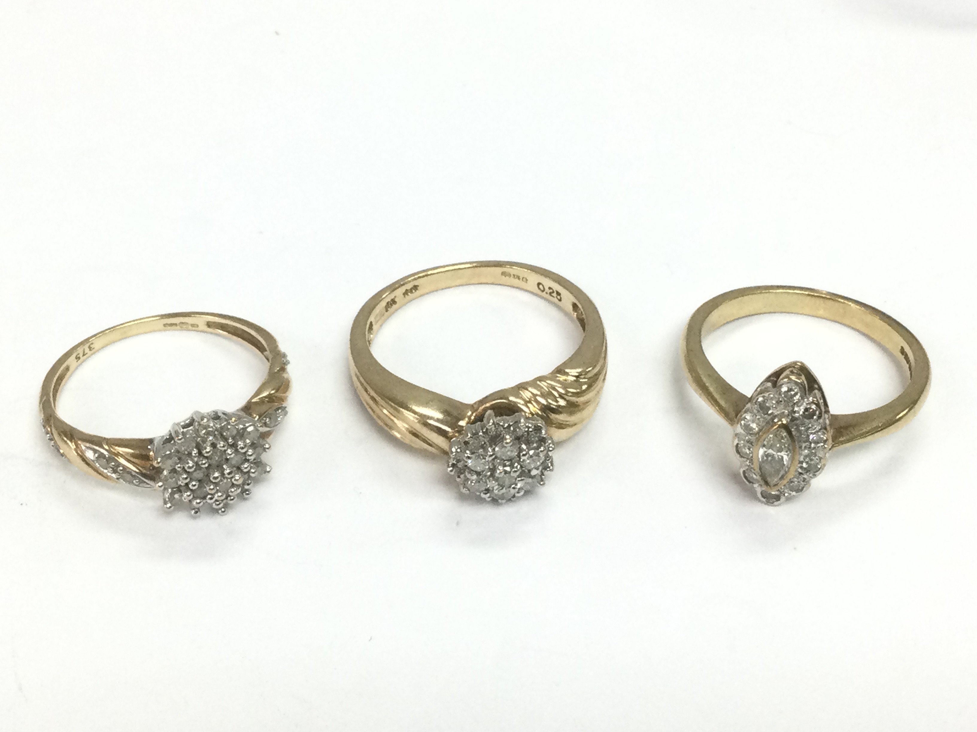 Three 9ct gold diamond cluster rings, approx sizes L, M and N. Total approx 8.4g. Shipping category A.