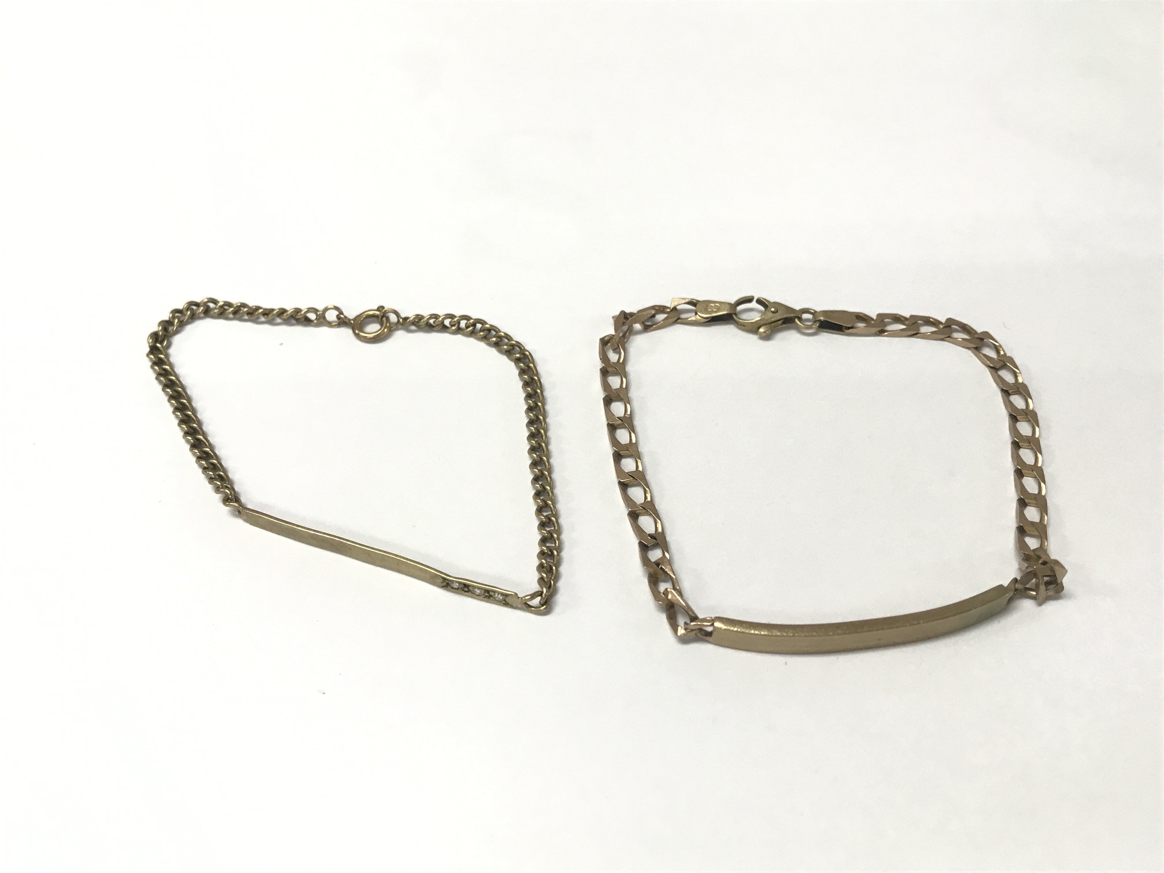 A pair of 9ct gold ID bracelet. 11.85g